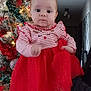 accessories, baby, christmas, christmasdecorations, christmastree, clothing, conifer, dress, face, festival, head, hugging, lighting, pants, person, photography, plant, portrait, sitting, tree