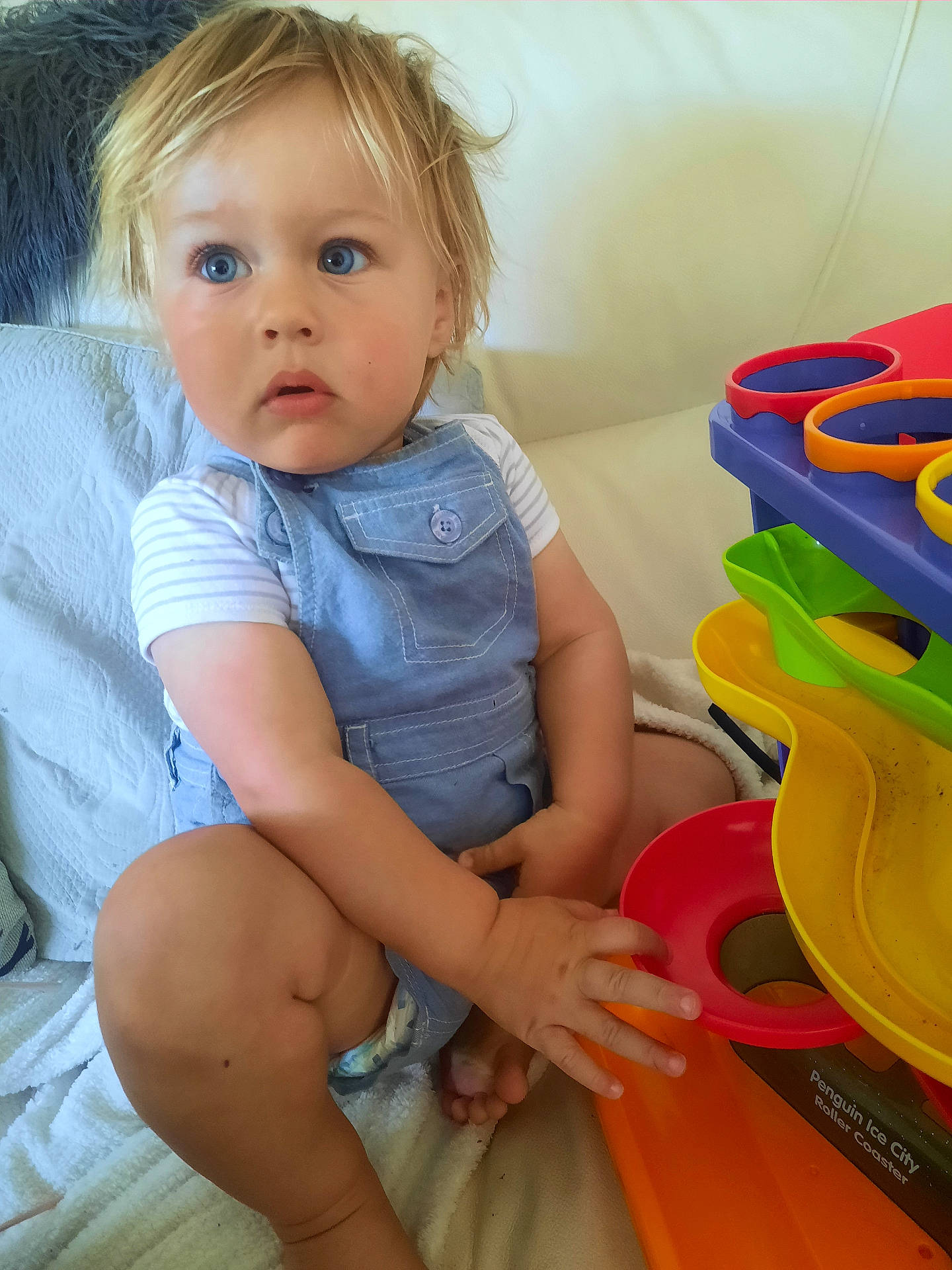 Rory joined the competition — help win amazing prizes! baby, bathroom, bodypart, clothing, couch, face, finger, furniture, hand, head, indoors, person, photography, portrait, room, sitting, t_shirt, tape, toilet, toy