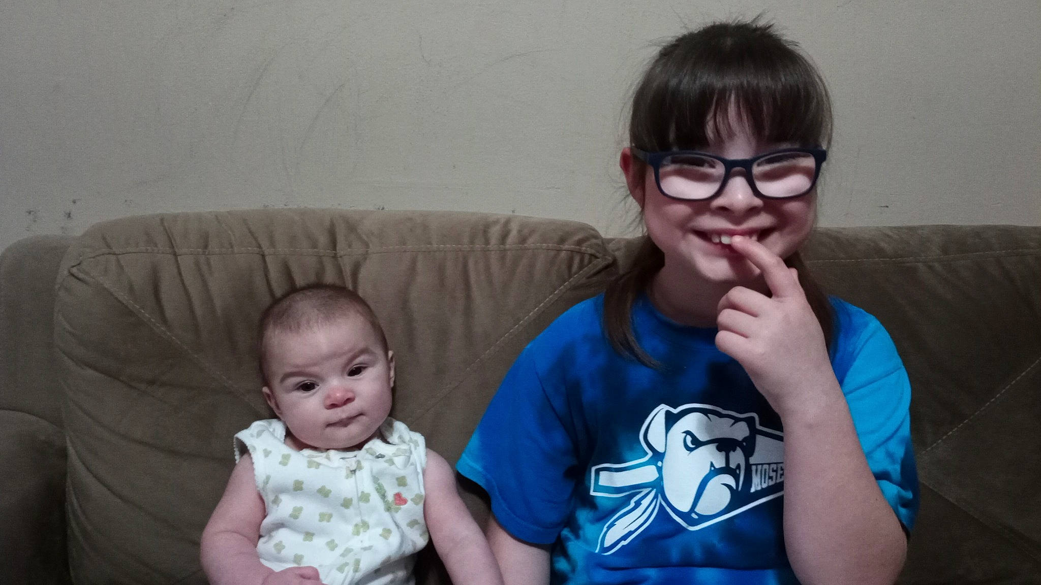 Evee is registered to the contest to win money with this photo: arm, cheek, chin, comfort, couch, eye, face, finger, gesture, glasses, happy, head, iris, joy, mouth, nose, person, skin, sleeve, smile