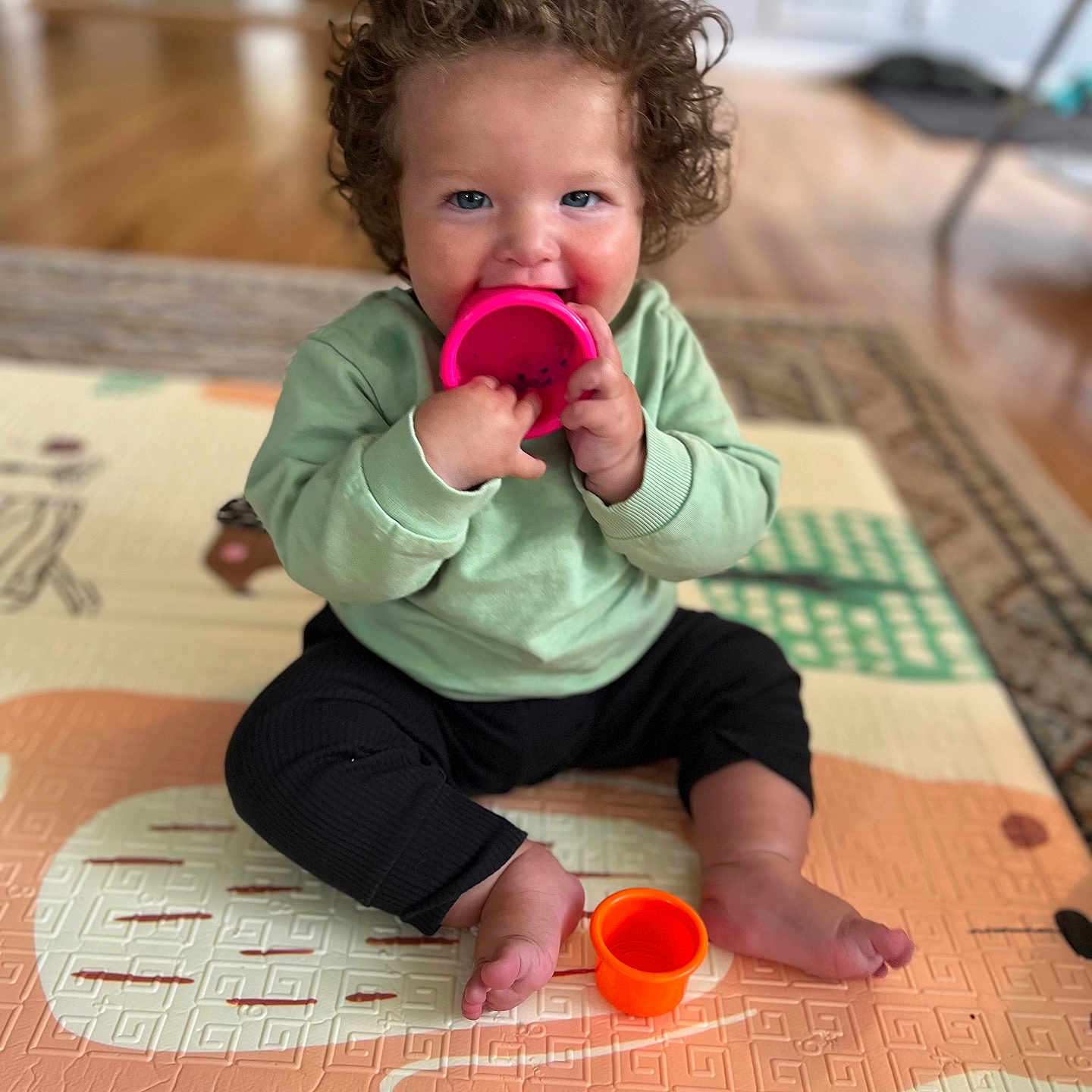 Amari joined the competition — help win amazing prizes! baby, beverage, bodypart, clothing, coffee, coffeecup, cup, cutlery, face, finger, hand, hardwood, head, pants, person, photography, portrait, sitting, spoon, wood