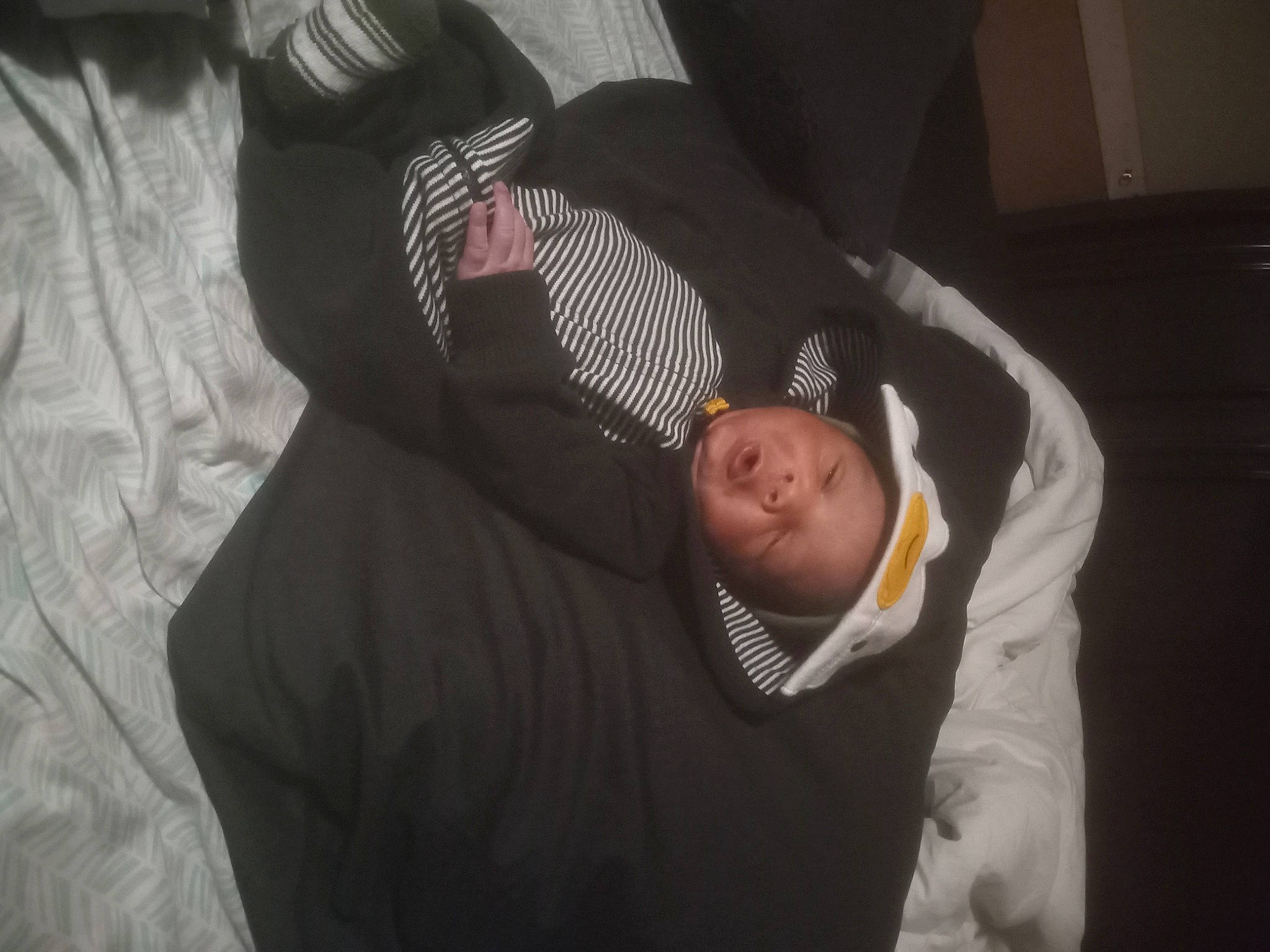 Curtes'Major is registered to the contest to win money with this photo: baby, baby_products, baby_toddler_clothing, child, comfort, darkness, elbow, flash_photography, flooring, fun, gesture, linens, nap, person, room, sitting, sleep, sleeve, toddler