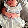 Phenix is registered to the contest to win money with this photo: baby, sleeping, child, blue_dress, headband, hands, folded_hands, blanket, soft_texture, curly_hair, infant, cute, resting, portrait, cozy, indoors, white_socks, peaceful, small_hands, newborn