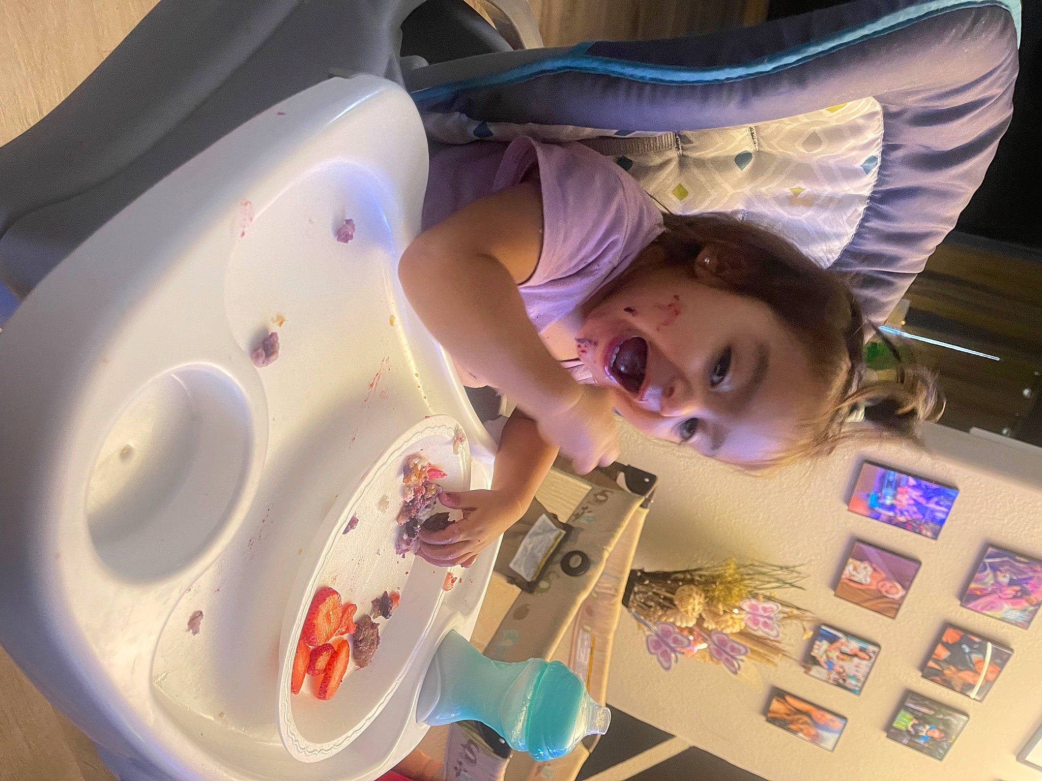 Arya is registered to the contest to win money with this photo: child, circle, eyelash, fashion_accessory, fun, hair, hairstyle, happy, leisure, person, pink, product, purple, room, skin, smile, space, t_shirt, toddler, toy