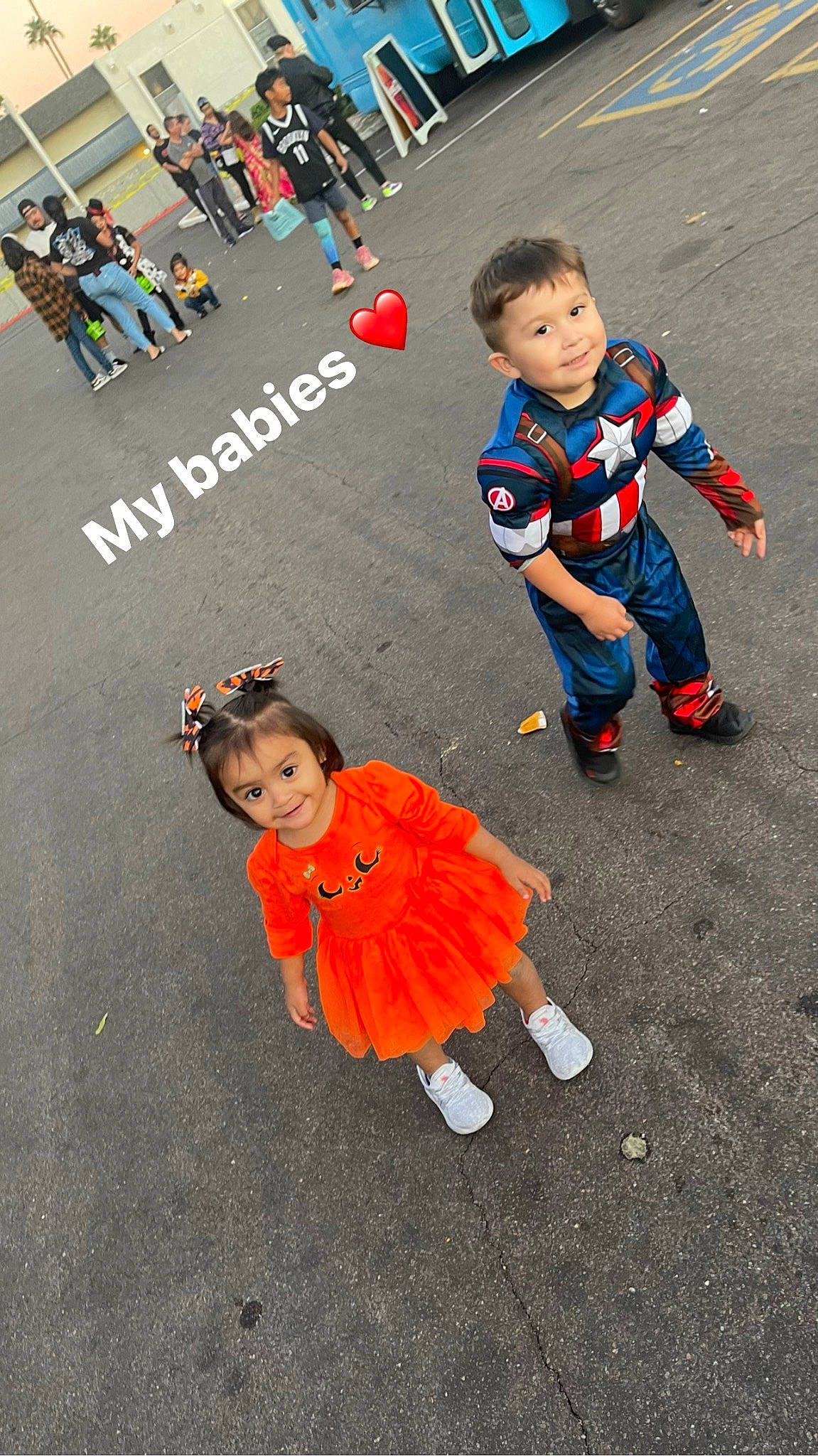 Arya is registered to the contest to win money with this photo: asphalt, blurred, child, costume, event, fun, joy, pedestrian, person, play, public_event, recreation, road, road_surface, street, t_shirt, toddler, vertebrate, walking