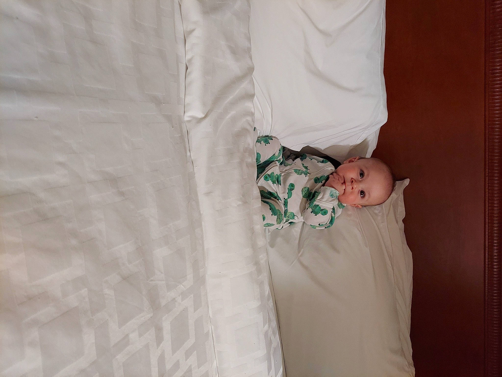 Elijah is registered to the contest to win money with this photo: baby, baby_products, baby_toddler_clothing, bed, bed_sheet, bedding, blanket, child, comfort, couch, linens, pattern, person, room, sleeve, t_shirt, textile, toddler, wood