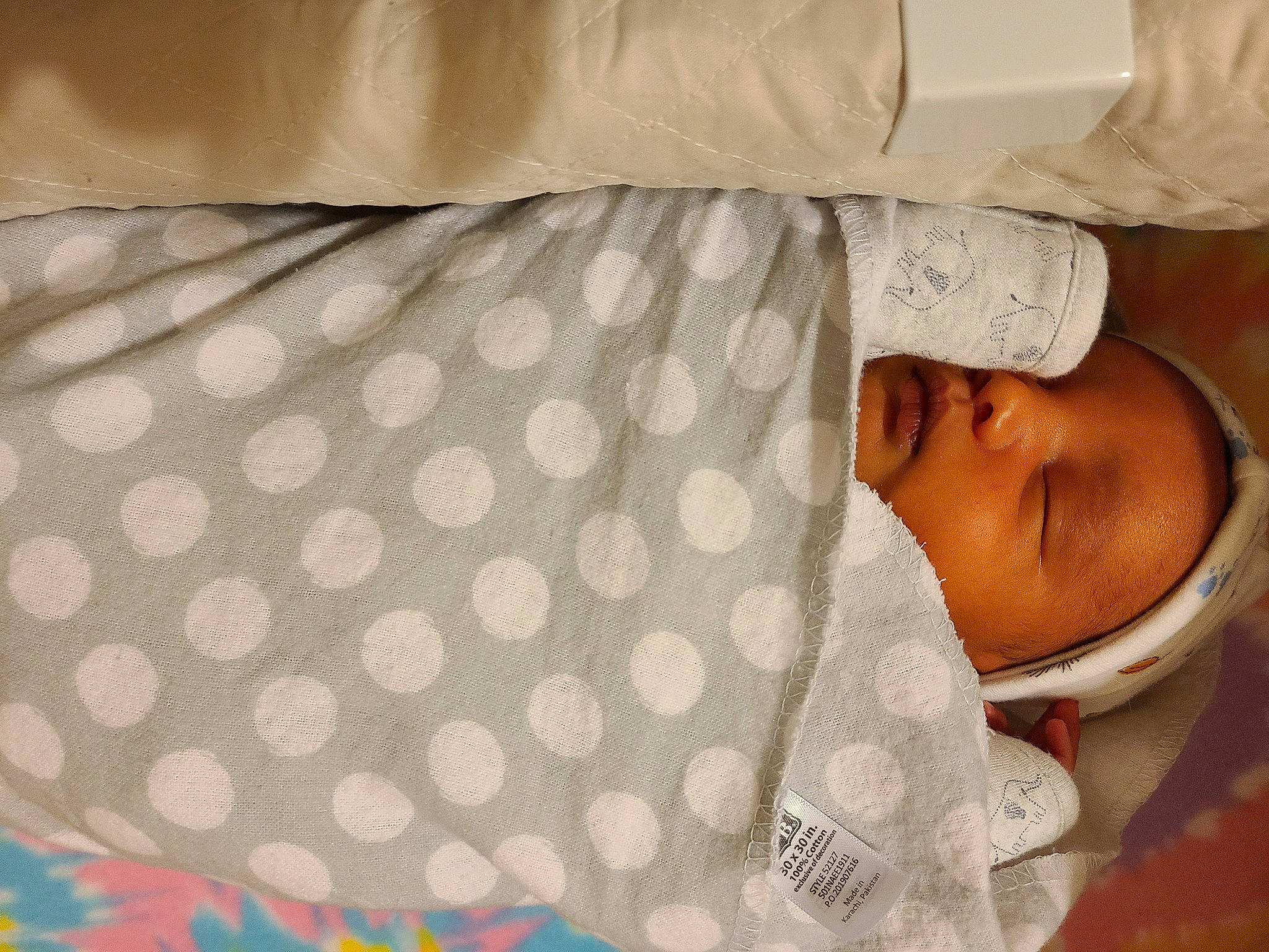 Ezrah is registered to the contest to win money with this photo: baby, baby_products, baby_toddler_clothing, beige, comfort, pattern, person, polka_dot