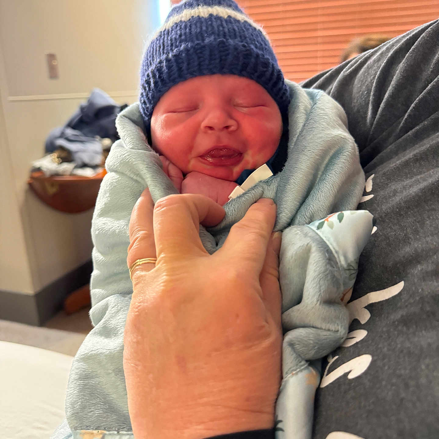 Kyson joined the competition — help win amazing prizes! architecture, baby, beanie, blanket, bodypart, bonnet, building, cap, childbirth, clothing, couch, face, finger, furniture, glove, hand, hat, head, hospital, knitwear