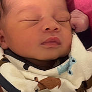 Zaiden is registered to the contest to win money with this photo: baby, newborn, sleeping, blanket, animal_print, face, hand, infant, cute, soft, cozy, portrait, closeup, resting, child, pink_background, warm, peaceful, wrapped, toddler