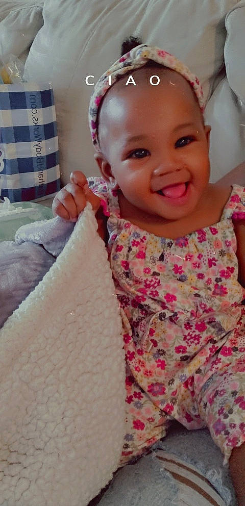 Ashlyn joined the competition — help win amazing prizes! baby, baby_toddler_clothing, beauty, child, face, finger, gesture, hand, happy, head, jewellery, joy, pattern, person, pink, skin, sleeve, smile, textile, thumb