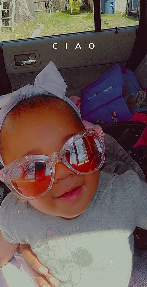 Ashlyn is registered to the contest to win money with this photo: cap, cheek, eyewear, finger, glasses, goggles, happy, headgear, jaw, lip, mouth, nose, person, personal_protective_equipment, pink, skin, smile, sunglasses, toddler, vision_care