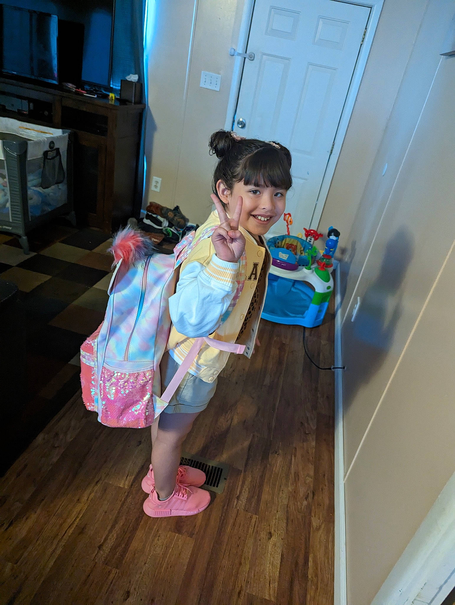 Miluv joined the competition — help win amazing prizes! child, door, floor, flooring, foot, fun, happy, hardwood, hat, home_appliance, human_leg, joy, kitchen_appliance, person, room, sandal, sitting, television, toddler, wood