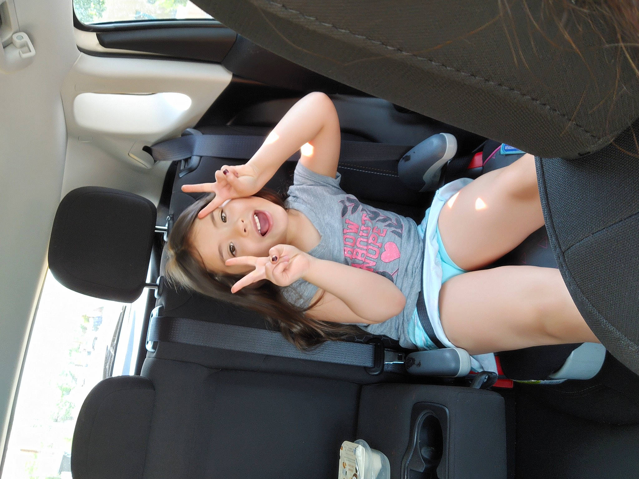 Miluv is registered to the contest to win money with this photo: auto_part, automotive_design, automotive_exterior, automotive_tire, automotive_wheel_system, car_seat, car_seat_cover, family_car, fun, human_leg, joint, luxury_vehicle, mode_of_transport, motor_vehicle, person, shorts, smile, thigh, travel, vehicle