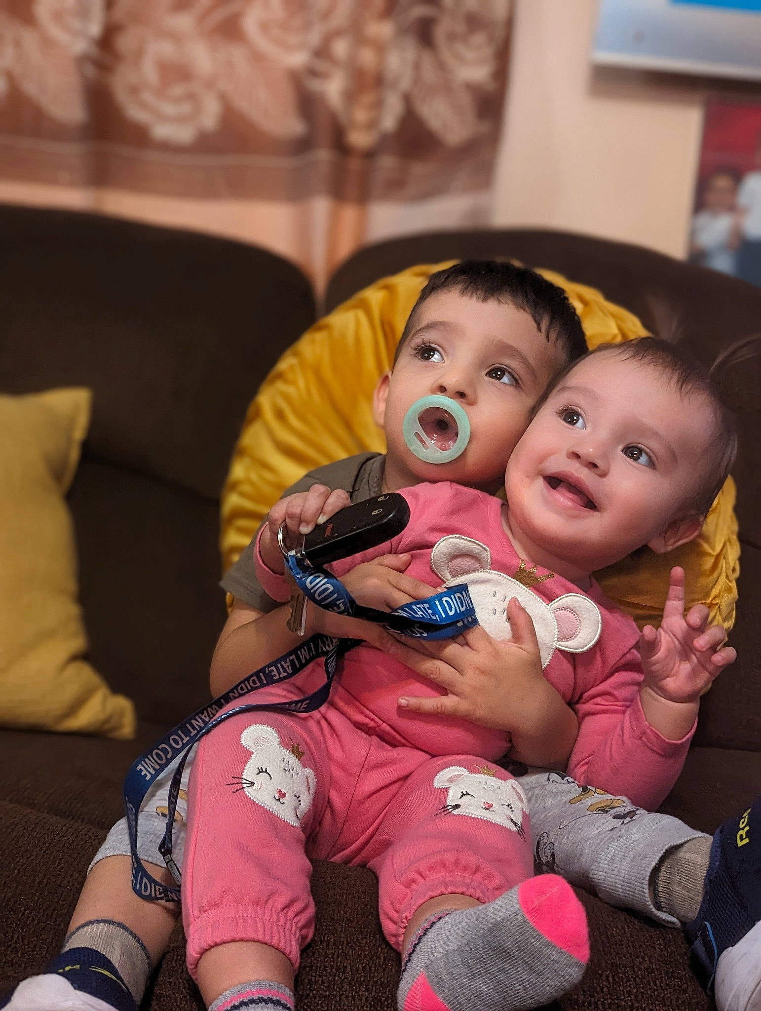 Isaiah is registered to the contest to win money with this photo: baby, baby_toddler_clothing, cheek, child, comfort, couch, event, facial_expression, fun, happy, human_leg, iris, knee, lap, person, picture_frame, room, sitting, skin, thigh