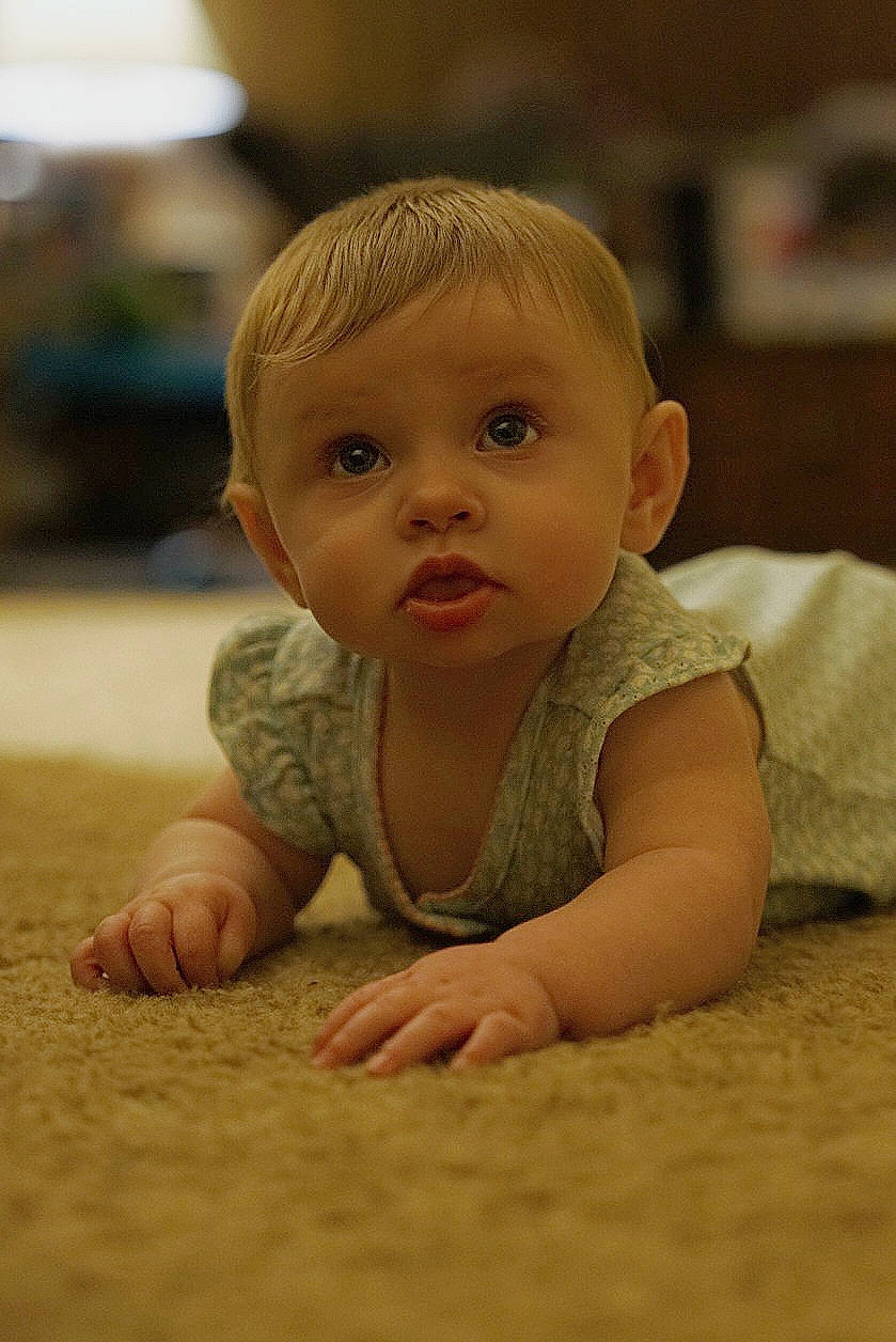 Haven is registered to the contest to win money with this photo: baby, baby_crawling, baby_toddler_clothing, cheek, crawling, eyebrow, floor, flooring, fun, happy, human_body, iris, mammal, nose, person, skin, smile, surprise, toddler, tummy_time