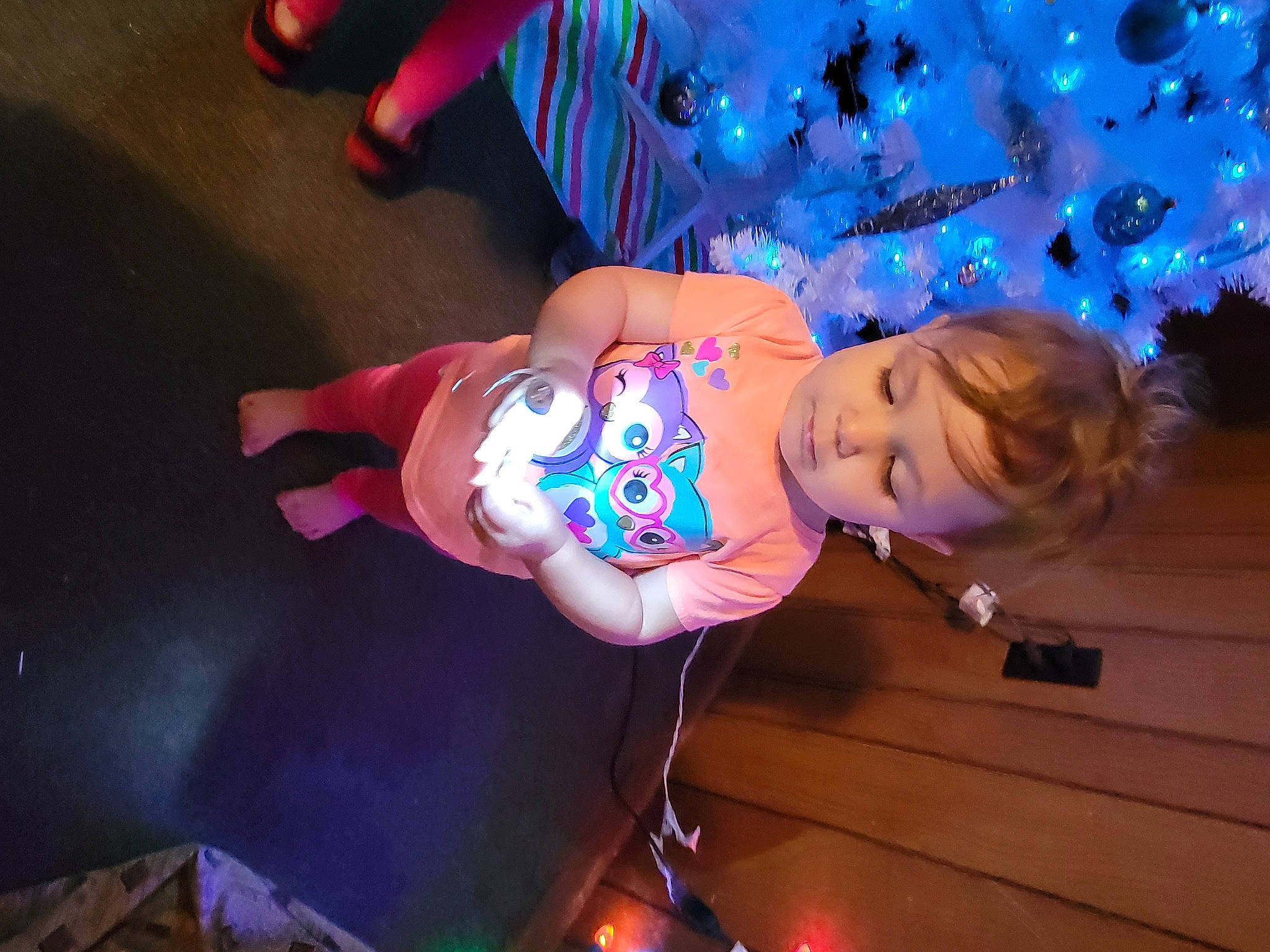 Eleanor joined the competition — help win amazing prizes! baby_toddler_clothing, child, christmas, christmas_decoration, christmas_tree, electric_blue, entertainment, event, fun, happy, holiday, magenta, ornament, party, person, pink, purple, sandal, toddler, tree
