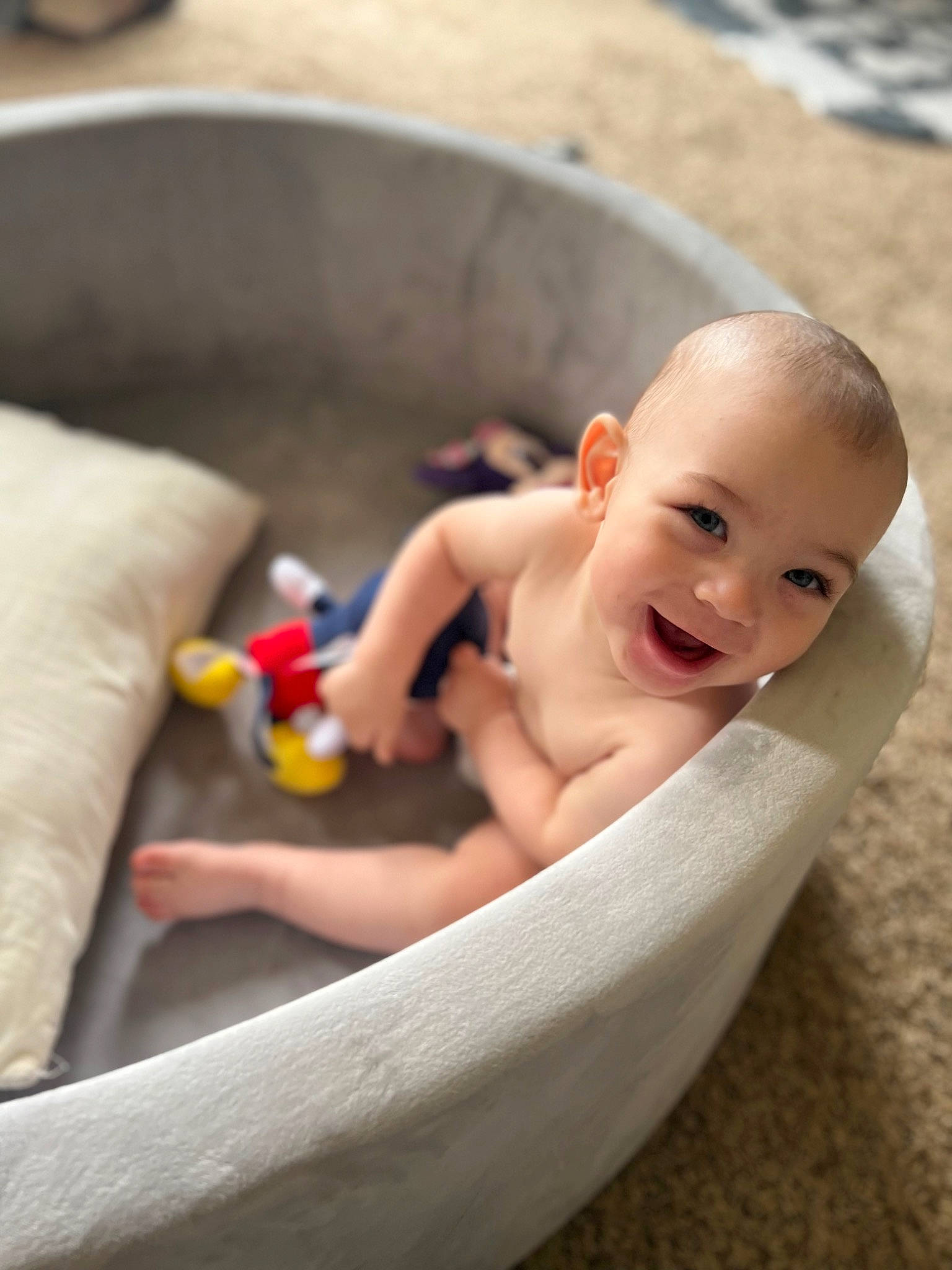 Jacoby is registered to the contest to win money with this photo: baby, baby_products, barefoot, bathing, chest, child, comfort, finger, foot, fun, happy, human_body, human_leg, leg, leisure, person, recreation, sitting, smile, toddler