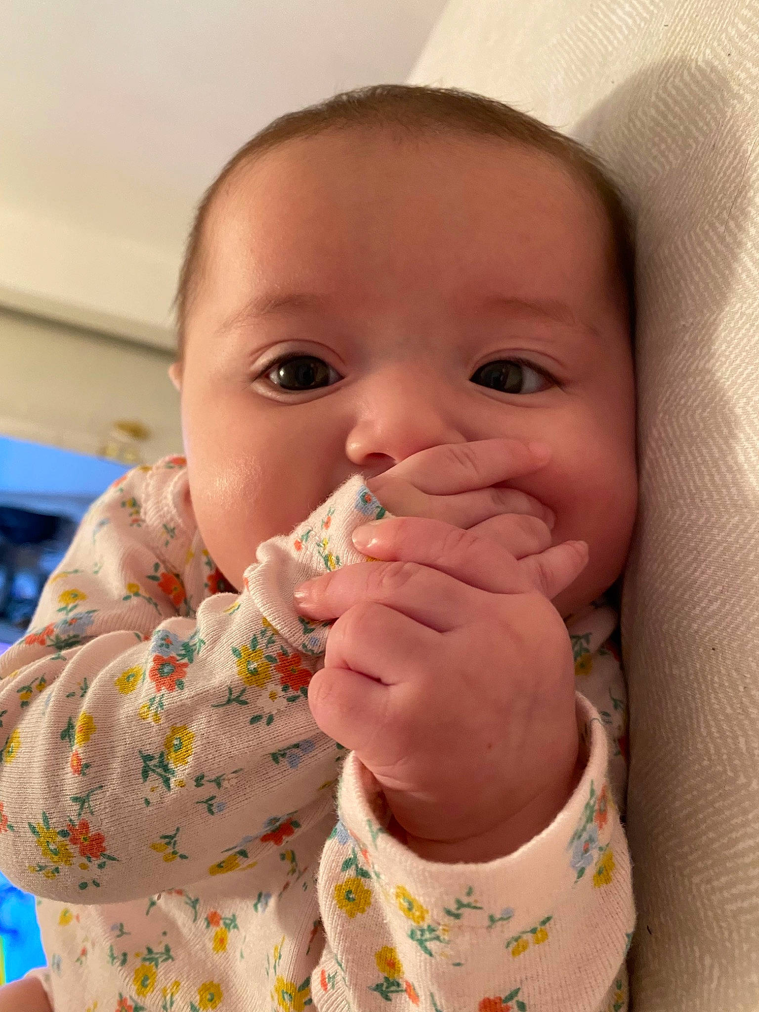 Alani is registered to the contest to win money with this photo: baby, baby_playing_with_food, baby_toddler_clothing, cheek, child, clothing, collar, finger, gesture, hand, happy, lip, mouth, nail, nose, person, skin, sleeve, textile, thumb