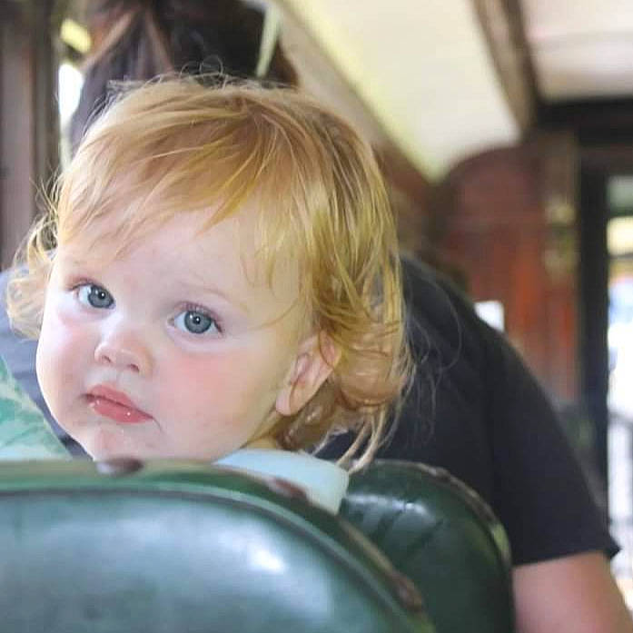 Gideon joined the competition — help win amazing prizes! auto_part, baby, blond, cheek, child, eyelash, fun, happy, leisure, person, sitting, toddler, vacation, windshield