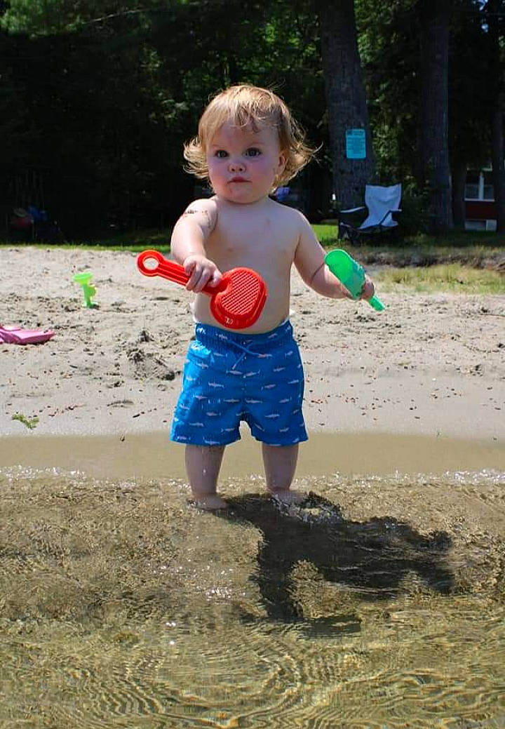 Gideon is registered to the contest to win money with this photo: ball, child, fun, grass, leisure, liquid_bubble, party_supply, people_in_nature, person, plant, play, recreation, sand, shorts, soil, sports_toy, t_shirt, toddler, toy, tree