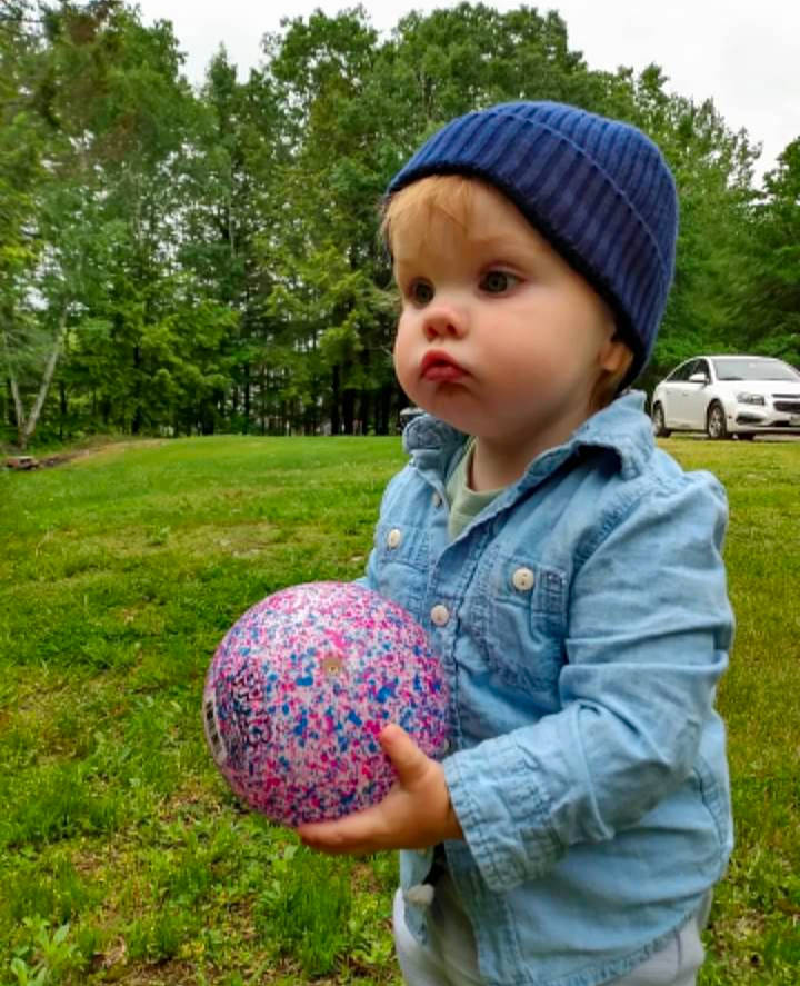 Gideon joined the competition — help win amazing prizes! baby, baby_toddler_clothing, ball, beanie, cap, car, child, electric_blue, fun, grass, grassland, headwear, leisure, pattern, people_in_nature, person, plant, recreation, sky, t_shirt