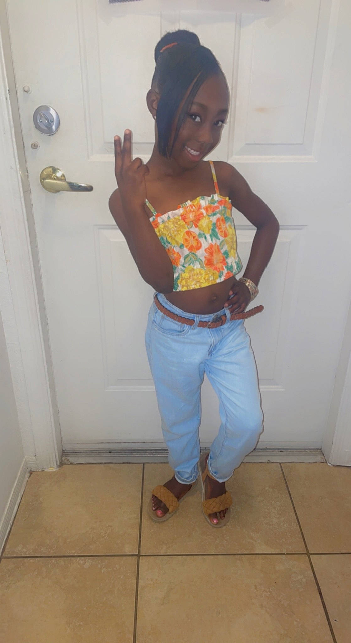 Kailey is registered to the contest to win money with this photo: abdomen, arm, belt, clothing, cool, denim, door, electric_blue, hair, human_body, human_leg, joy, knee, long_hair, neck, person, sleeve, smile, t_shirt, thigh