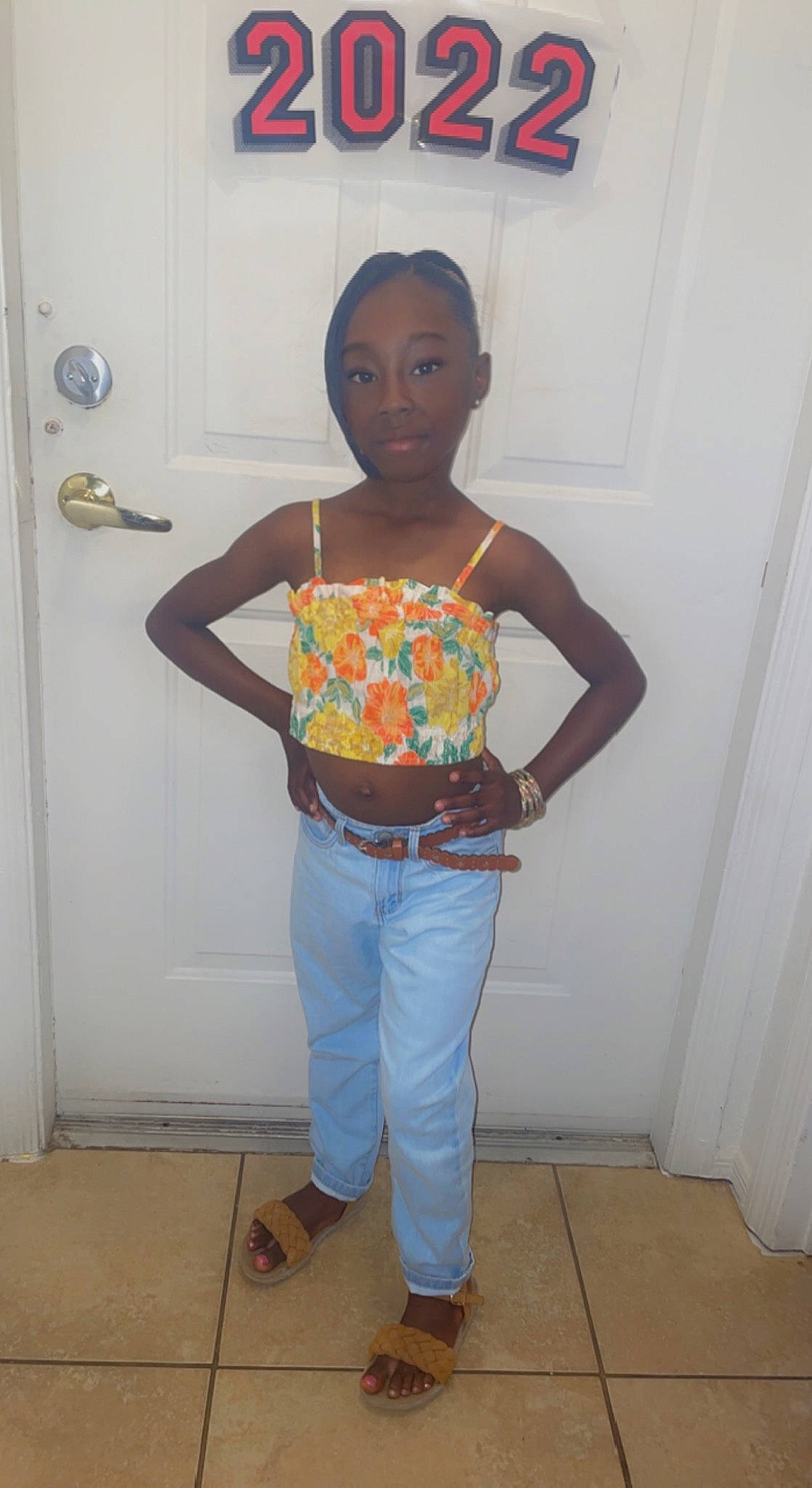 Kailey is registered to the contest to win money with this photo: abdomen, belt, chest, denim, door, elbow, electric_blue, flooring, gas, human_leg, knee, leg, neck, person, room, sleeve, sweatpant, t_shirt, thigh, trunk