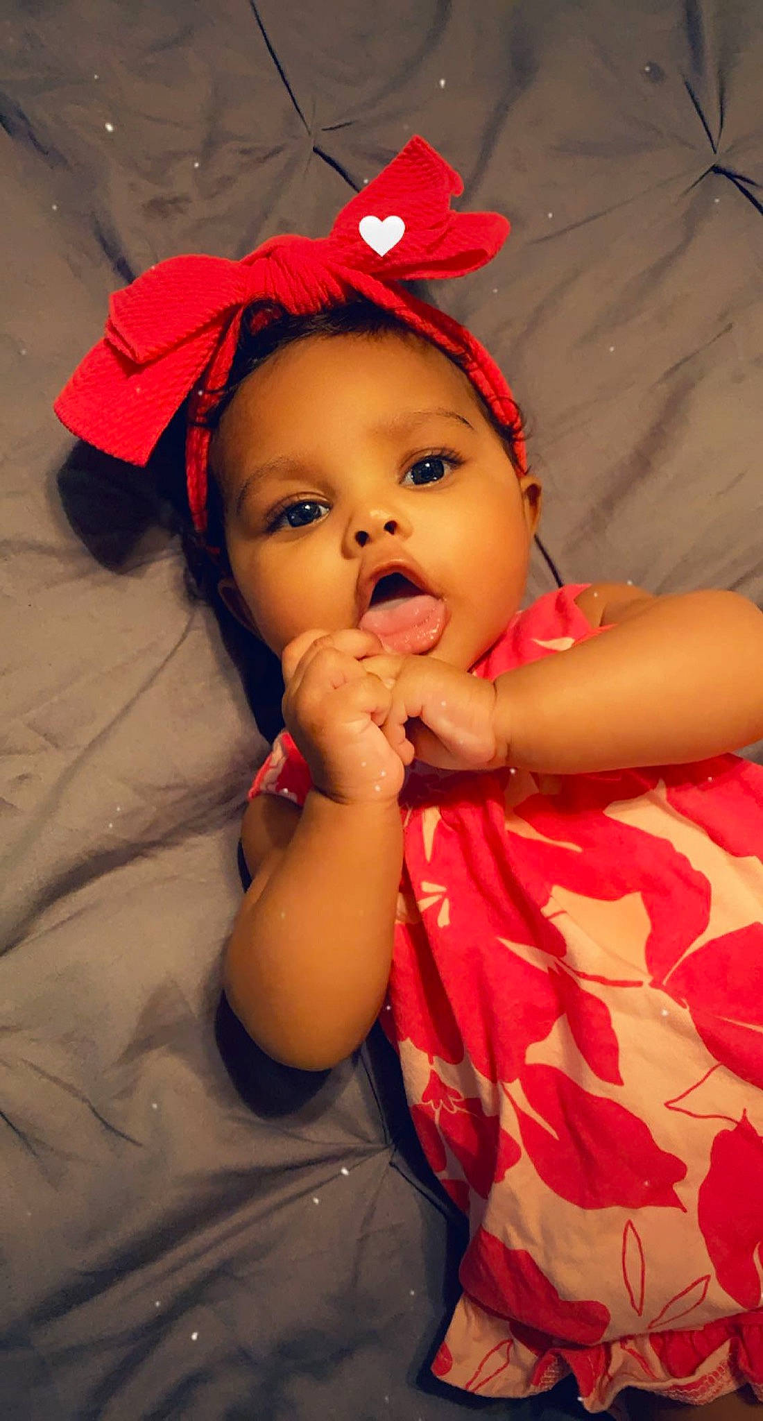 Bryleigh is registered to the contest to win money with this photo: baby, baby_toddler_clothing, cap, cheek, child, comfort, finger, fun, gesture, happy, hat, iris, lip, mouth, nose, orange, organ, person, pink, skin