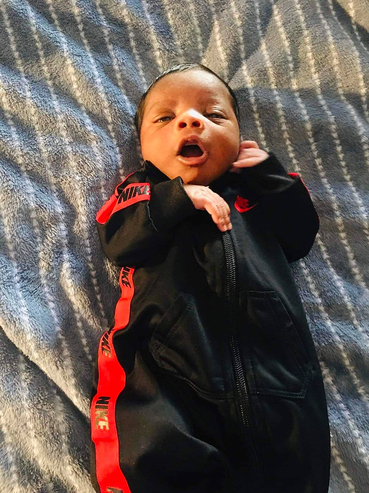 Malaki joined the competition — help win amazing prizes! asphalt, baby, baby_toddler_clothing, cheek, child, flash_photography, formal_wear, fun, happy, jacket, linens, orange, outerwear, person, portrait_photography, road_surface, sitting, sleeve, smile, textile