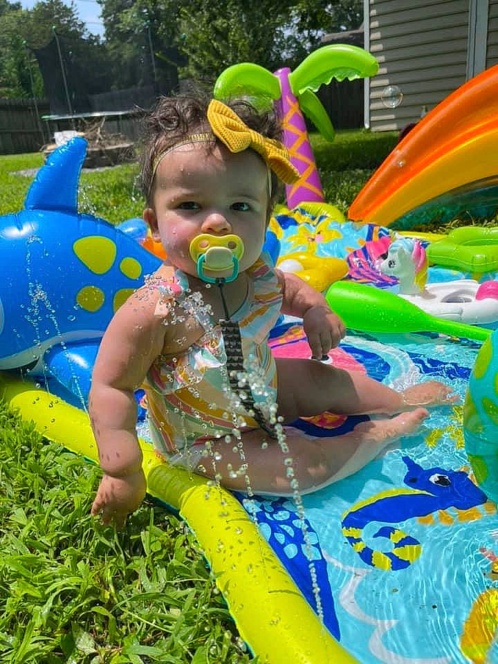 Sarai joined the competition — help win amazing prizes! baby_toddler_clothing, blue, child, event, fun, garden, grass, green, happy, leisure, person, plant, play, product, recreation, smile, spring, summer, toddler, toy