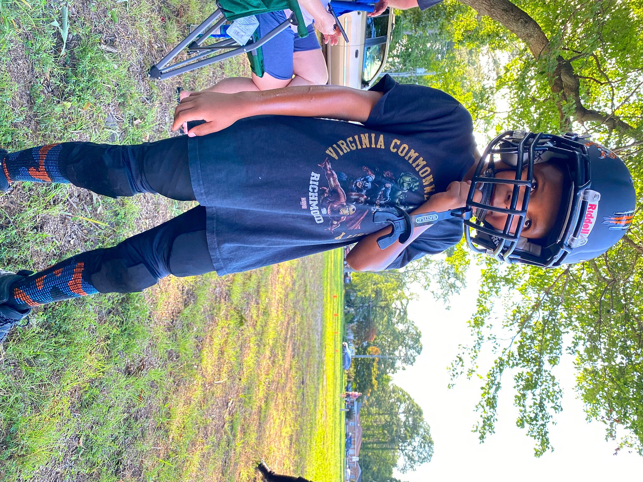 Malachi is registered to the contest to win money with this photo: cool, electric_blue, eyewear, fun, grass, happy, helmet, human_leg, leisure, light, people_in_nature, person, plant, recreation, shoe, sneakers, t_shirt, thigh, tree, walking_shoe