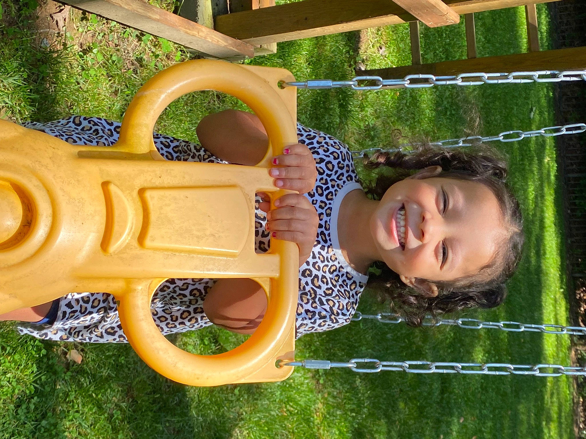 Maleia is registered to the contest to win money with this photo: automotive_wheel_system, baby_toddler_clothing, child, chute, city, facial_expression, fun, grass, happy, joy, leisure, outdoor_play_equipment, people_in_nature, person, plant, play, playground, recreation, smile, toddler