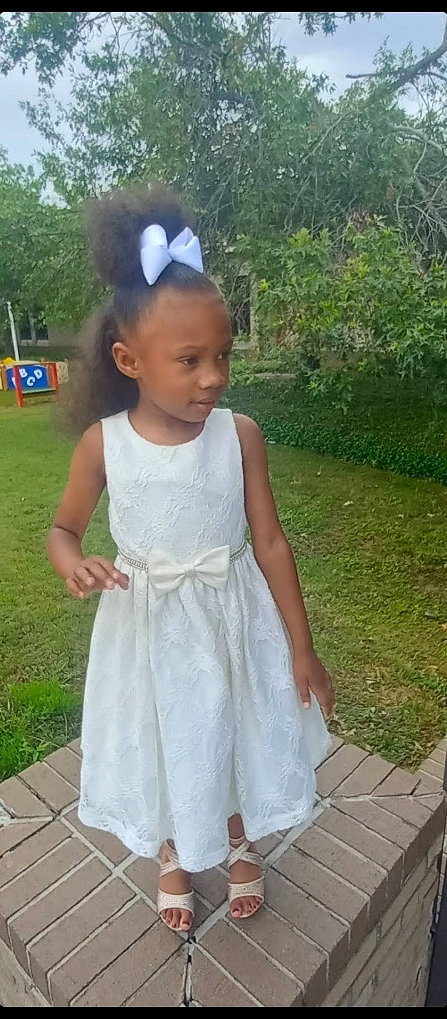 Shi'Laia joined the competition — help win amazing prizes! baby_toddler_clothing, bridal_accessory, child, day_dress, dress, embellishment, fashion_accessory, fun, grass, hair, happy, head, neck, one_piece_garment, pattern, person, plant, shoulder, sleeve, toddler