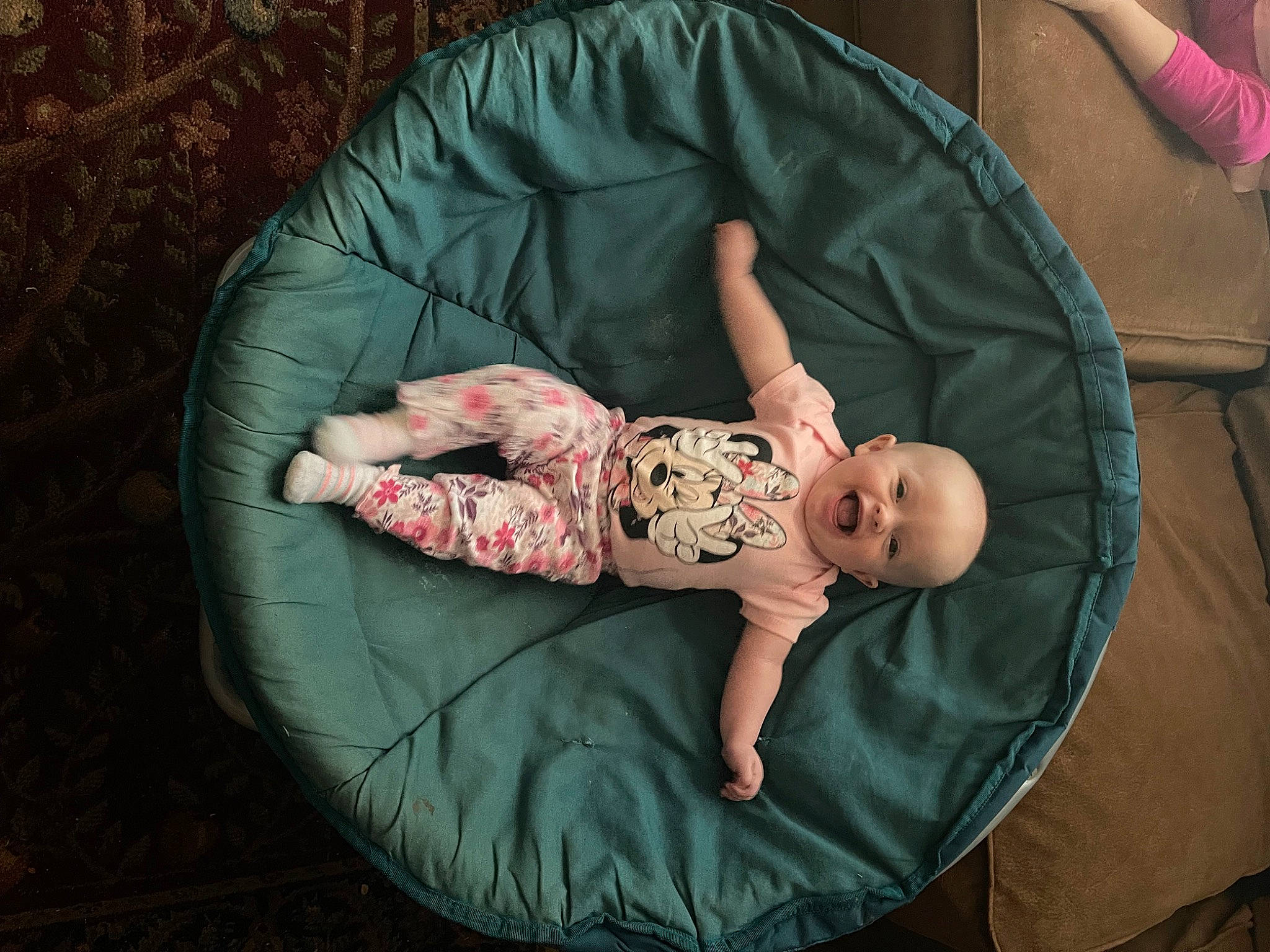 Kensley joined the competition — help win amazing prizes! baby, baby_products, baby_toddler_clothing, child, comfort, foot, fun, grass, head, lap, leg, linens, person, pink, room, sitting, skin, sleeve, sock, toddler