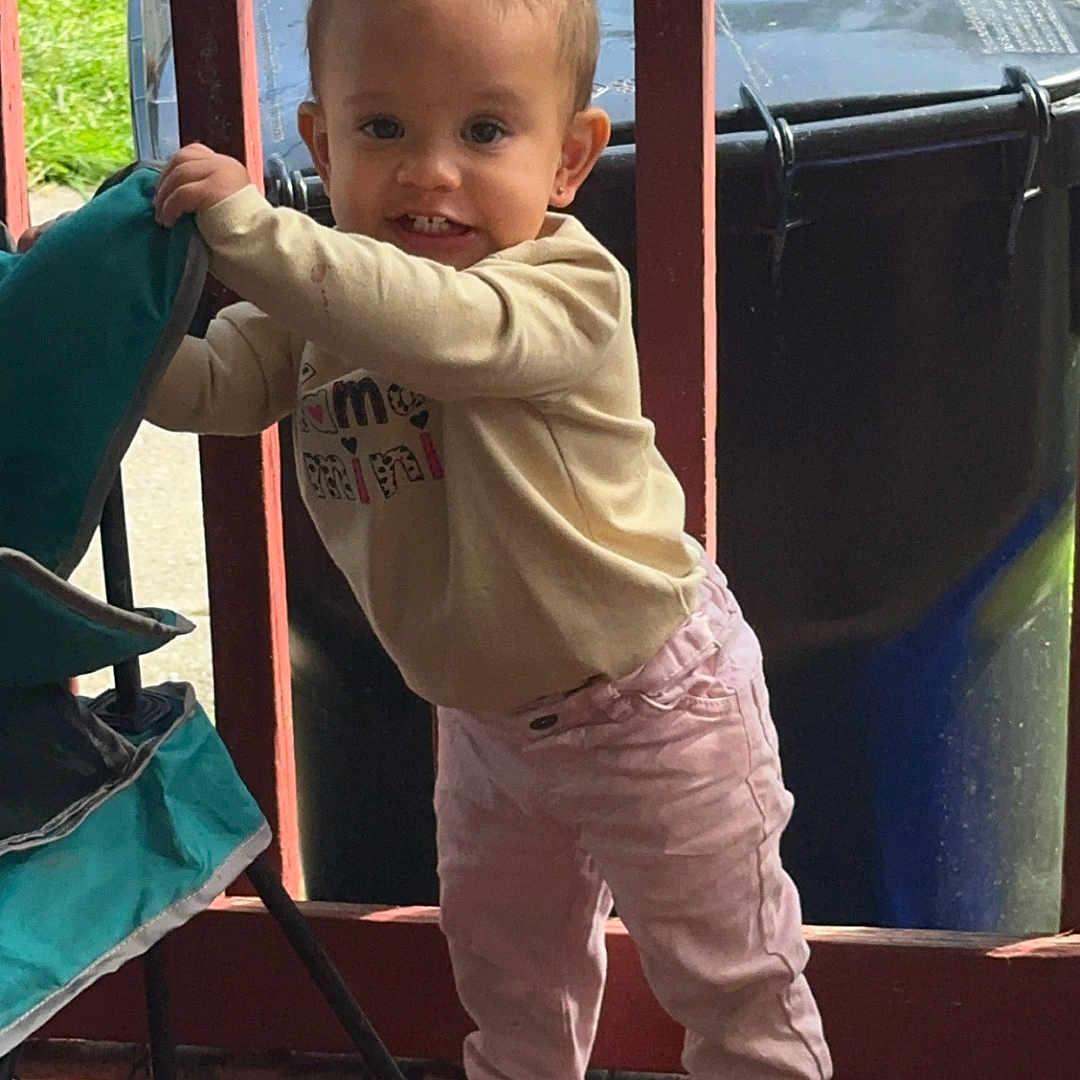 Raya joined the competition — help win amazing prizes! baby, chair, clothing, face, footwear, furniture, head, jeans, outdoors, pants, person, photography, playarea, portrait, shoe, shorts, sitting, sneaker, transportation, wood