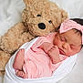 newborn, baby, teddy_bear, pink_clothing, headband, sleeping, blanket, soft_toy, infant, cute, cozy, closeup, portrait, baby_girl, rest, child, bed, comfort, adorable, peaceful