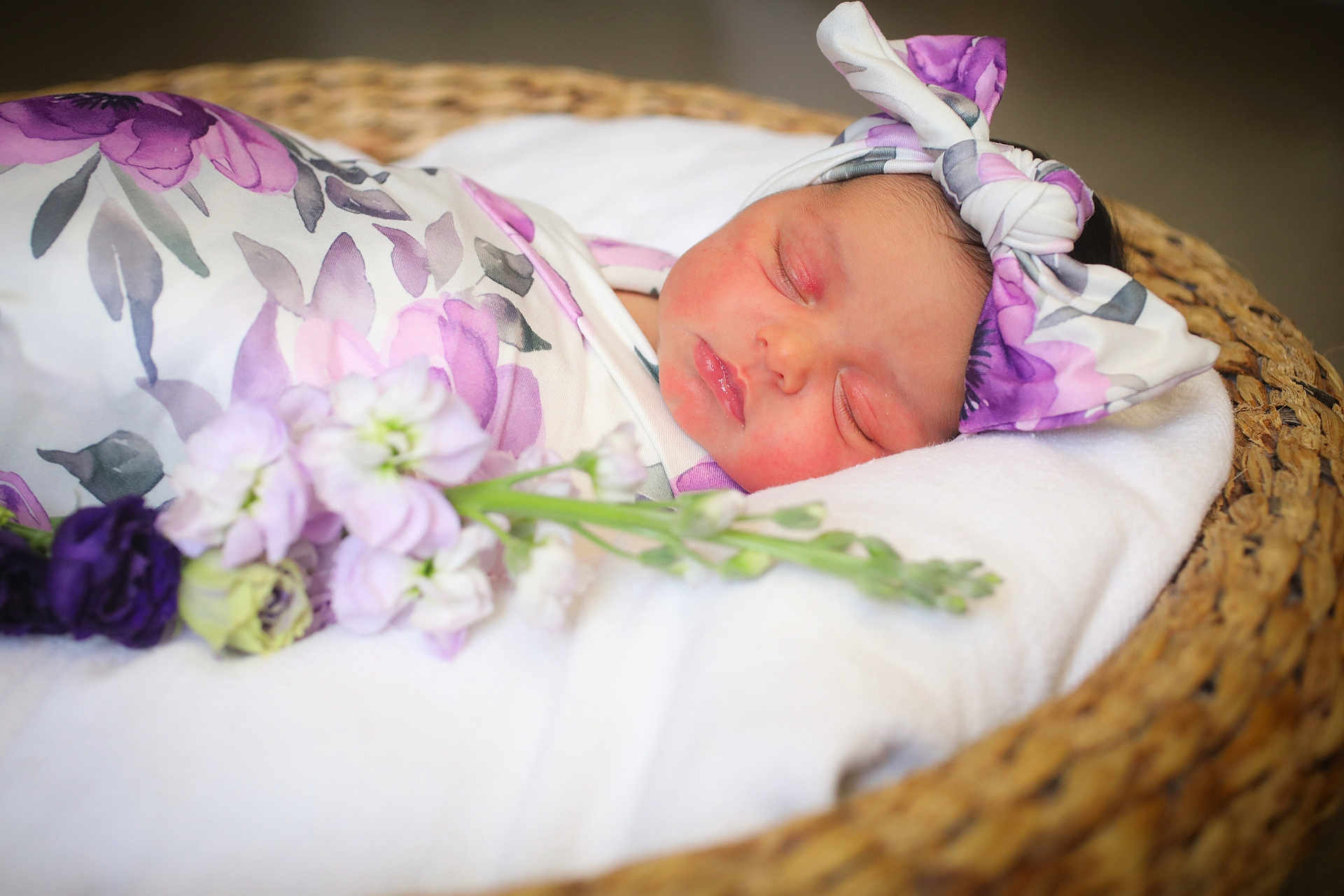 Riley is registered to the contest to win money with this photo: newborn, baby, sleeping, blanket, headband, floral, basket, flower, peaceful, infant, wrapped, soft, cute, portrait, resting, closeup, child, adorable, cozy, toddler