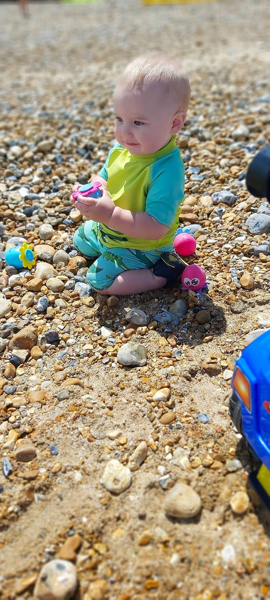 Ethan is registered to the contest to win money with this photo: adaptation, child, fun, gravel, outdoor_play_equipment, person, play, sand, soil, toddler