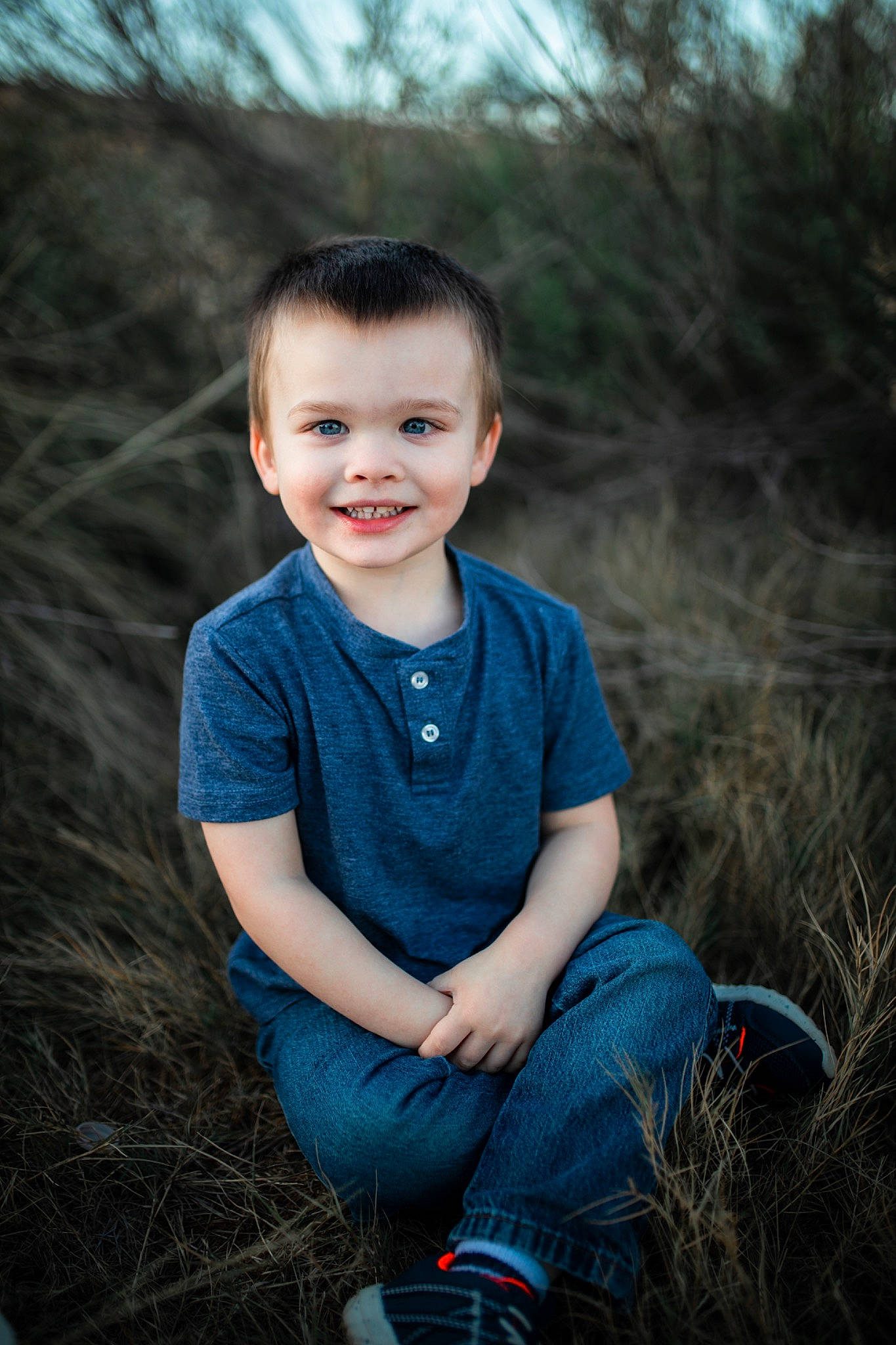 Brandon joined the competition — help win amazing prizes! blue, child, child_model, eye, face, flash_photography, grass, joy, male, people, person, photo_shoot, photograph, photography, plant, portrait, portrait_photography, sitting, smile, standing
