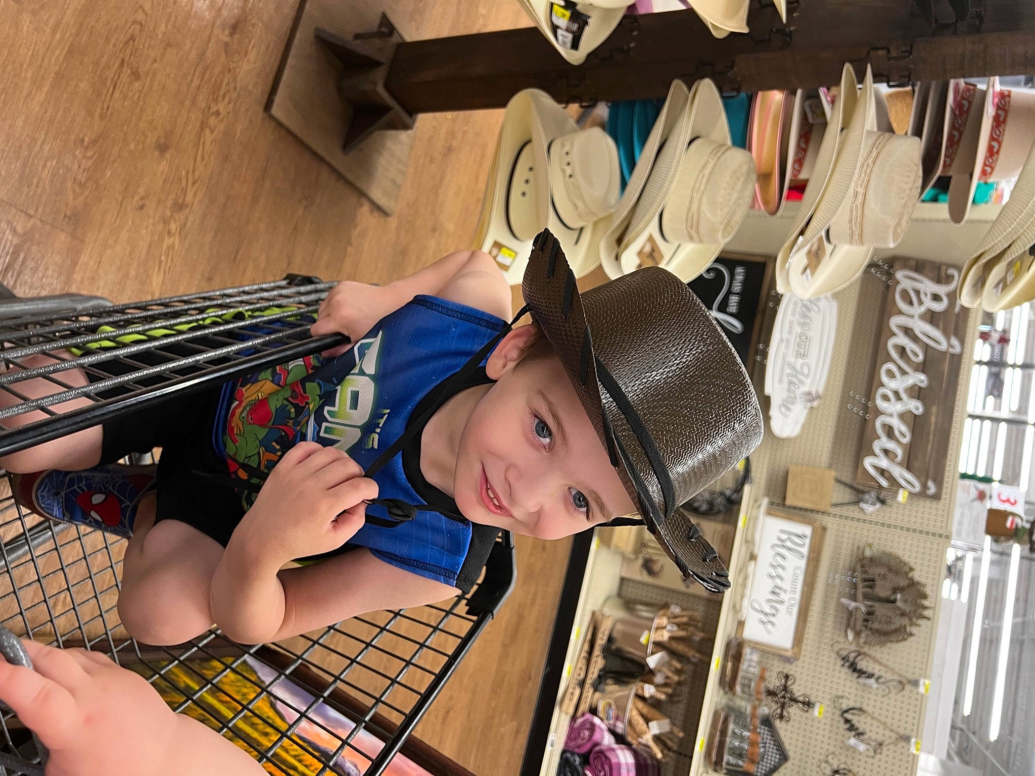 Brandon is registered to the contest to win money with this photo: cap, child, fashion_accessory, fun, happy, hat, headgear, headwear, human_leg, joy, leisure, pattern, person, plaid, sandal, smile, street_fashion, sun_hat, t_shirt, tartan