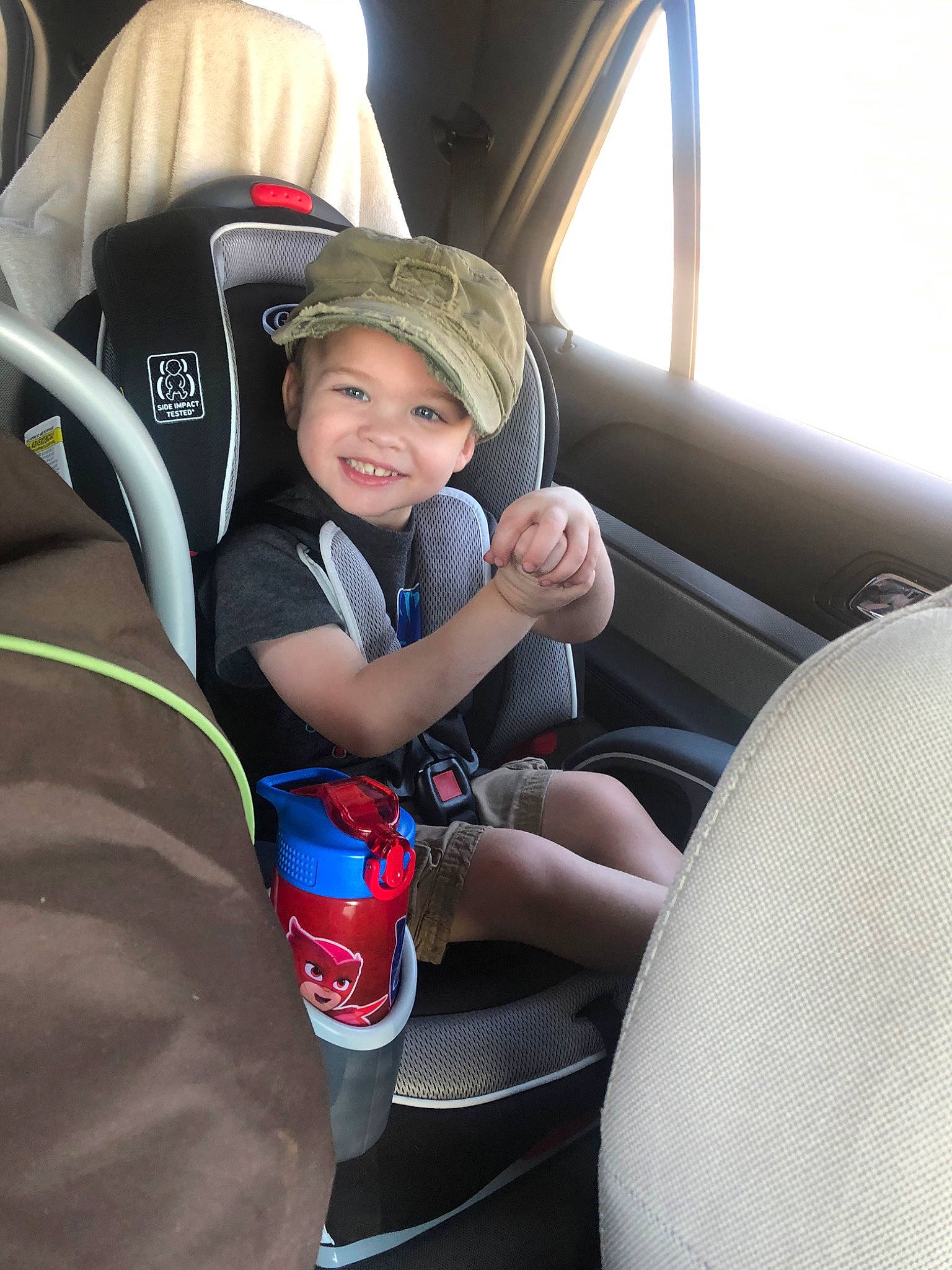 Brandon is registered to the contest to win money with this photo: auto_part, baby_in_car_seat, car, car_seat, car_seat_cover, child, comfort, family_car, joy, person, seat_belt, toddler, vehicle