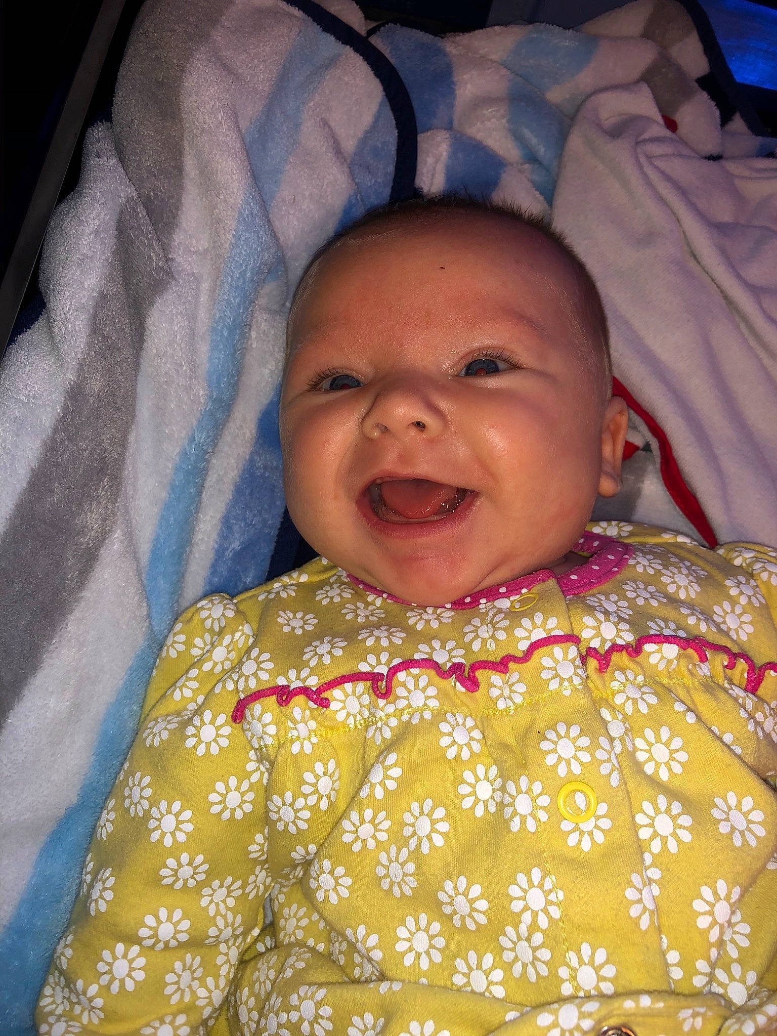 Emma is registered to the contest to win money with this photo: baby, cheek, child, eye, face, facial_expression, forehead, happy, head, iris, lip, mouth, nose, person, skin, smile, textile, toddler, yellow