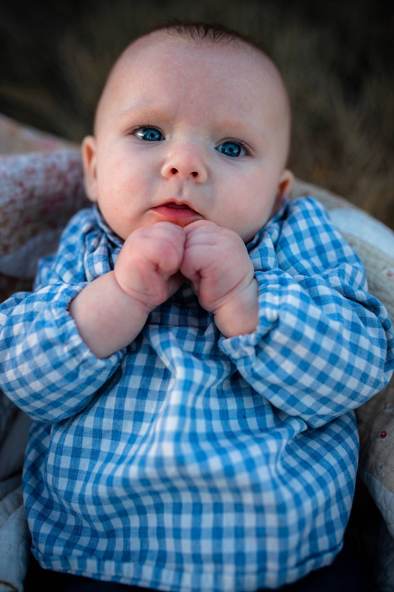 Emma is registered to the contest to win money with this photo: baby, blue, cheek, child, eye, face, finger, hand, head, lip, nose, person, portrait_photography, sitting, skin, toddler