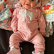 Tinsley is registered to the contest to win money with this photo: baby, bonnet, cap, clothing, couch, cushion, face, footwear, furniture, hat, head, homedecor, newborn, pants, person, photography, portrait, shoe, sitting, sneaker