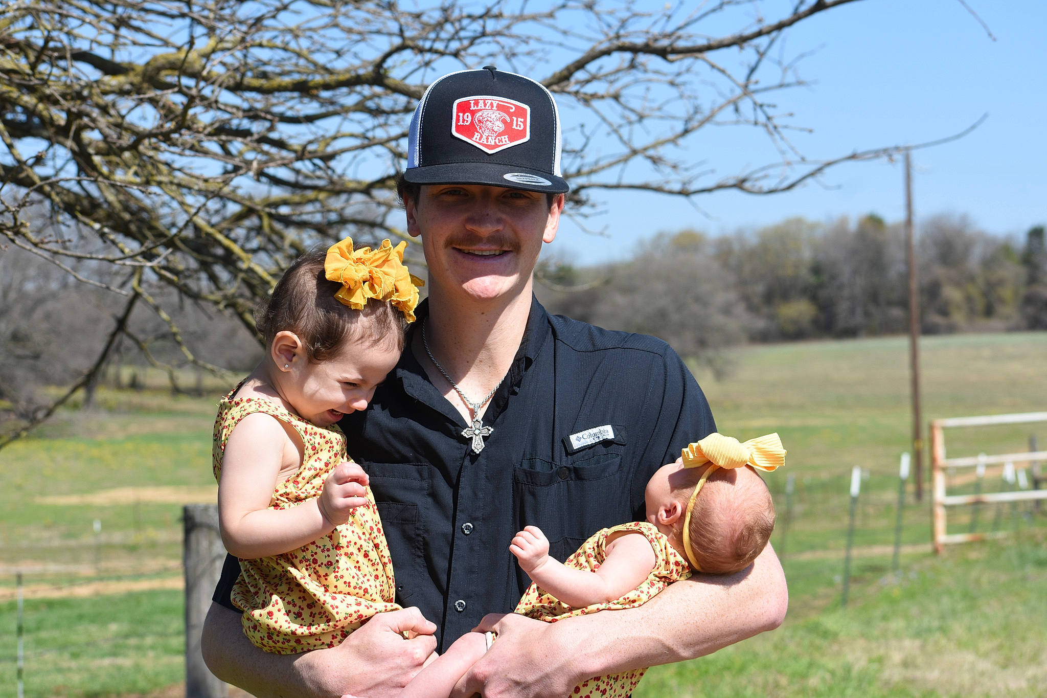 Raelynn Grace is registered to the contest to win money with this photo: baby, baseball_cap, cap, child, event, face, flash_photography, fun, gesture, grass, happy, hat, headwear, interaction, jewellery, joy, people_in_nature, person, plant, sky