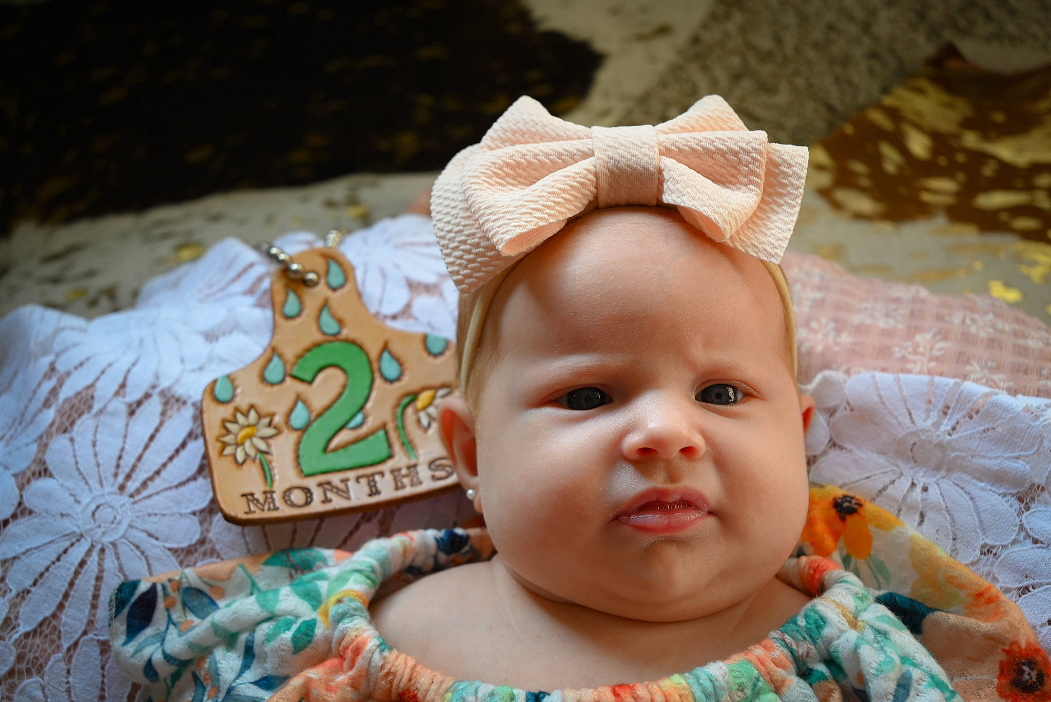 Everleigh Olevia Garcia is registered to the contest to win money with this photo: baby, baby_toddler_clothing, cheek, chin, eye, eyelash, face, facial_expression, grass, happy, hat, head, headgear, iris, lip, mouth, nose, person, skin, smile