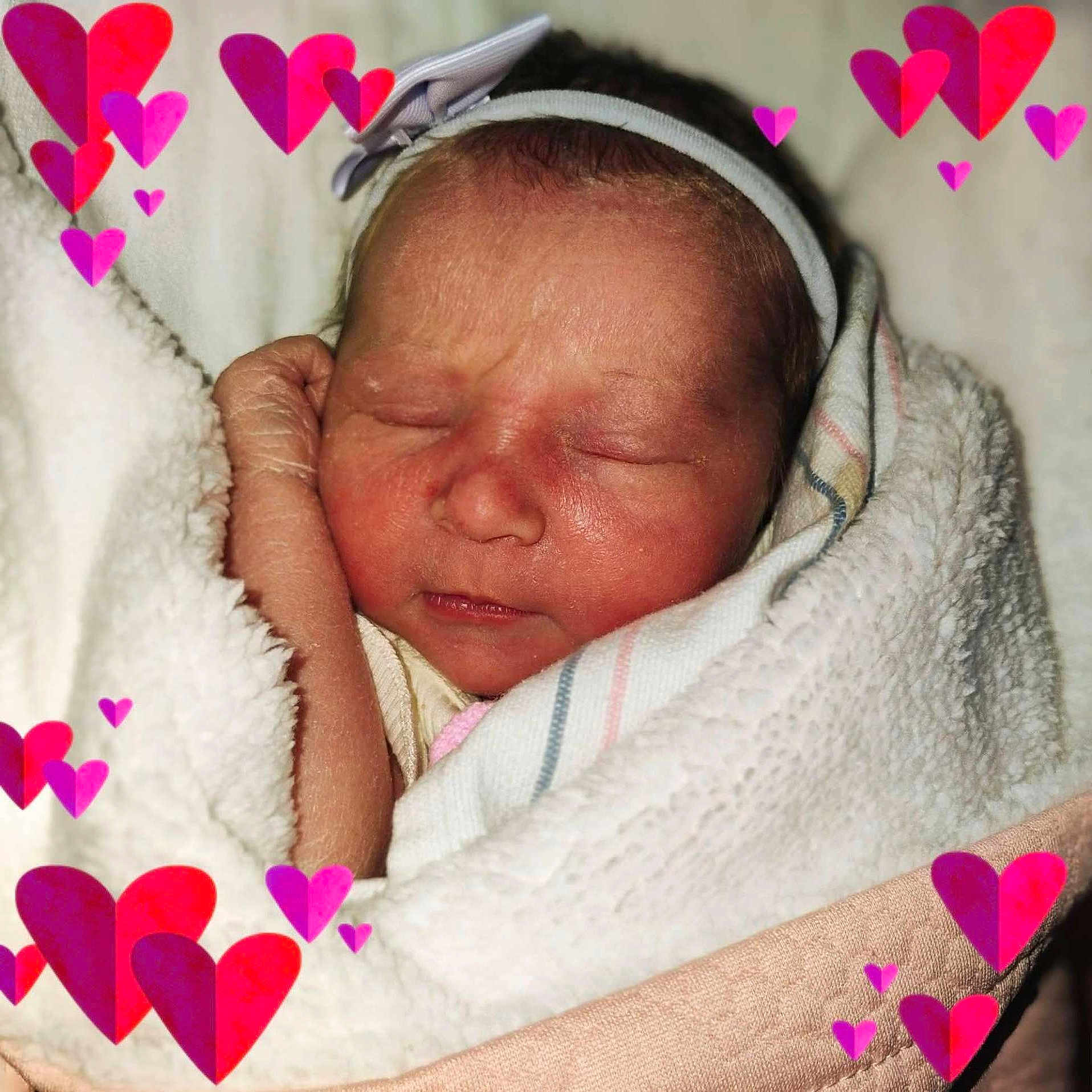 Lonnie joined the competition — help win amazing prizes! newborn, baby, sleeping, blanket, headband, heart_graphics, wrapped, closeup, soft_texture, infant, face, peaceful, cute, skin, portrait, resting, cozy, toddler, love, child