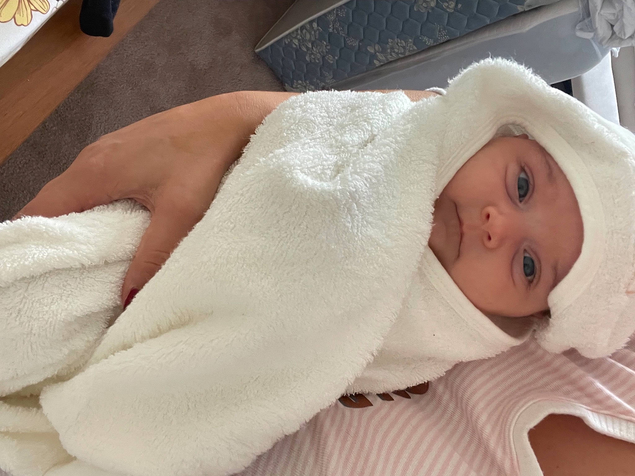 Maisie joined the competition — help win amazing prizes! baby, baby_products, baby_sleeping, baby_toddler_clothing, cheek, child, comfort, flooring, fur, hat, headwear, human_body, linens, lip, nose, person, sleeve, textile, toddler, towel