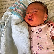 Keanani is registered to the contest to win money with this photo: baby, bed, blanket, bodypart, cradle, crib, cushion, face, finger, furniture, hand, head, homedecor, infantbed, newborn, person, photography, portrait, quilt, towel