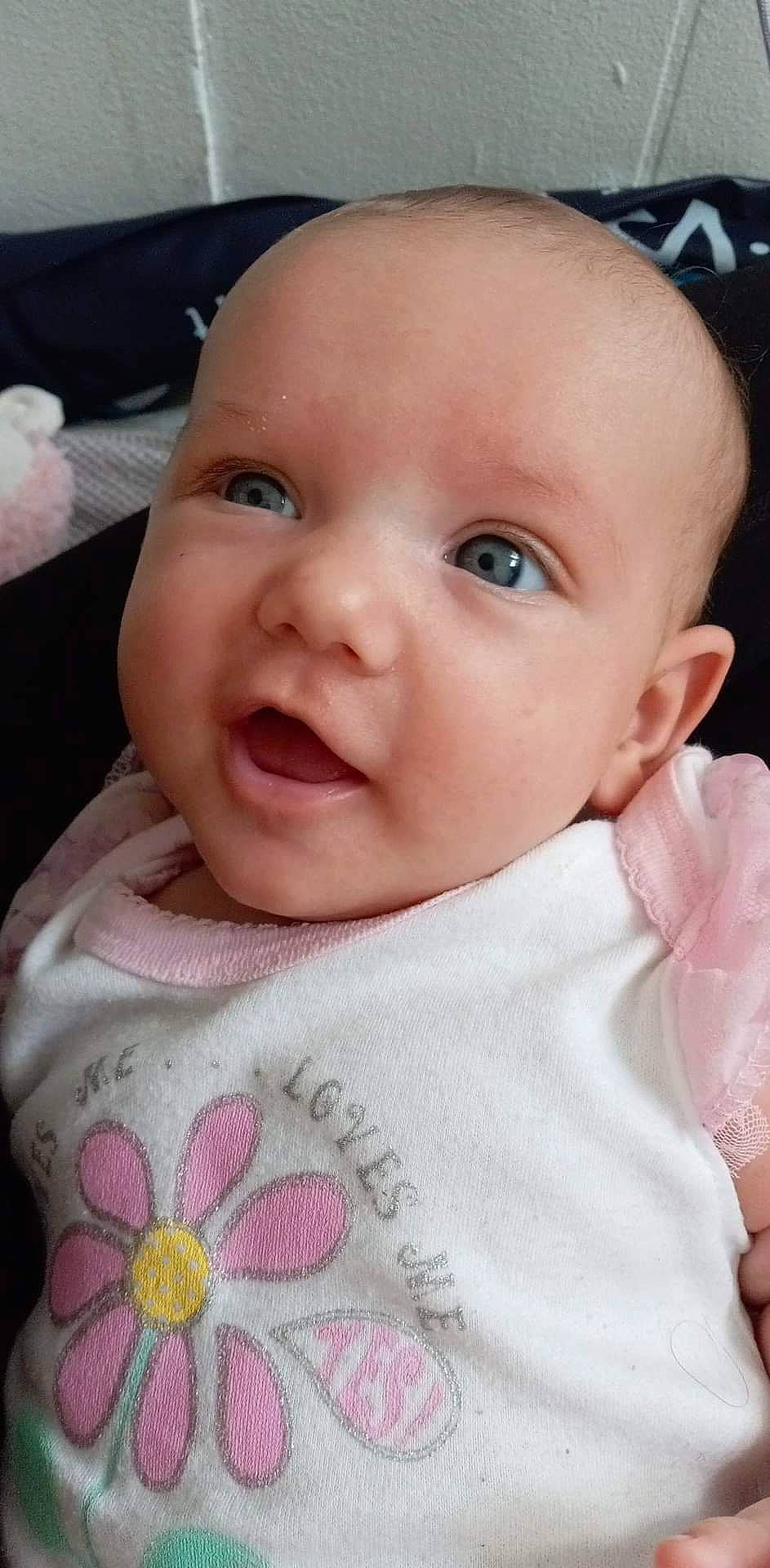 Kinsley is registered to the contest to win money with this photo: baby, baby_toddler_clothing, cheek, child, chin, clothing, collar, eyelash, happy, iris, lip, nose, pattern, person, pink, product, skin, sleeve, smile, toddler