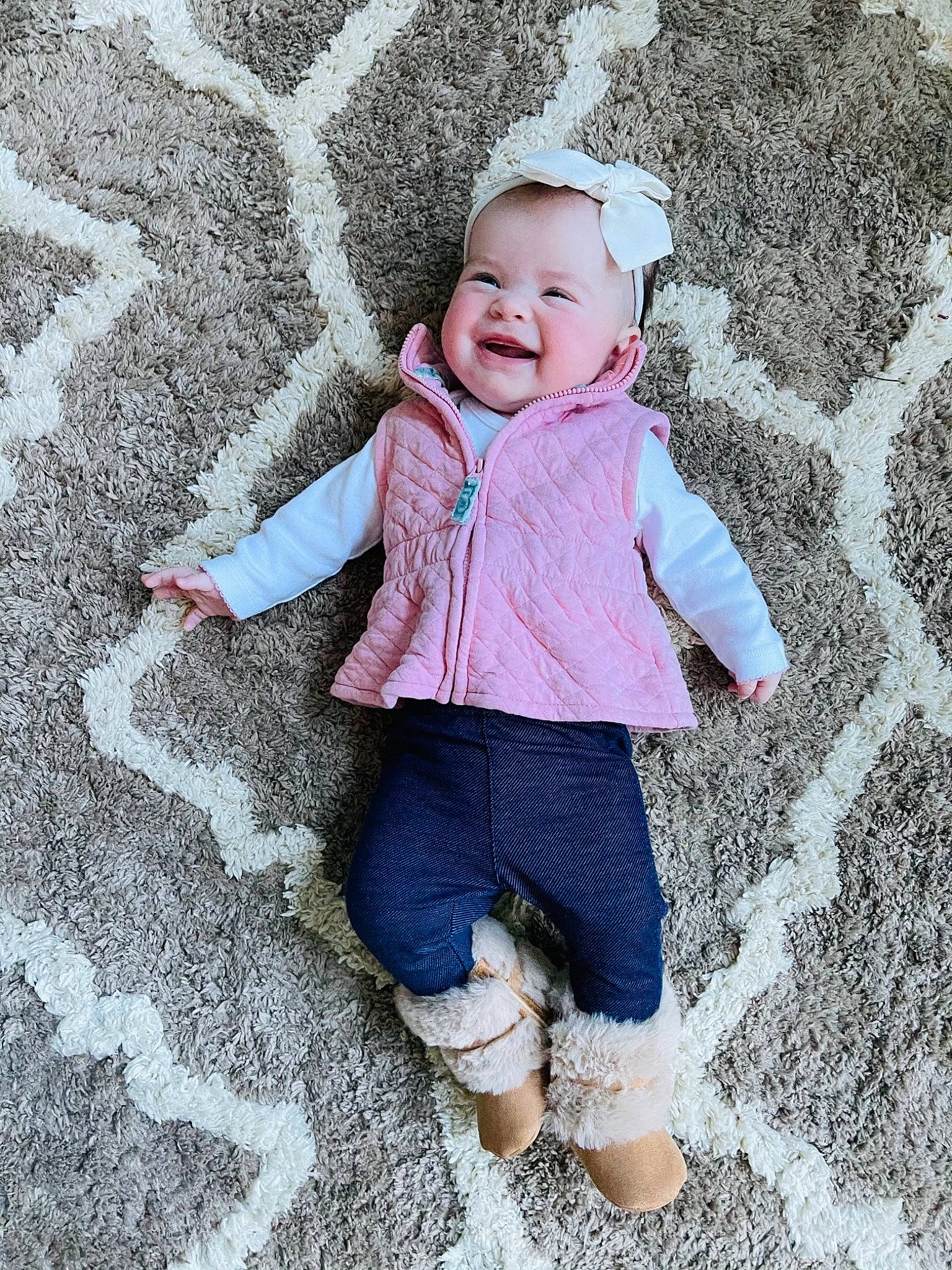 Rylie joined the competition — help win amazing prizes! baby_laughing, baby_toddler_clothing, bonnet, child, child_model, hood, jacket, joy, laugh, person, playing_in_the_snow, sleeve, smile, snow, sock, toddler, winter